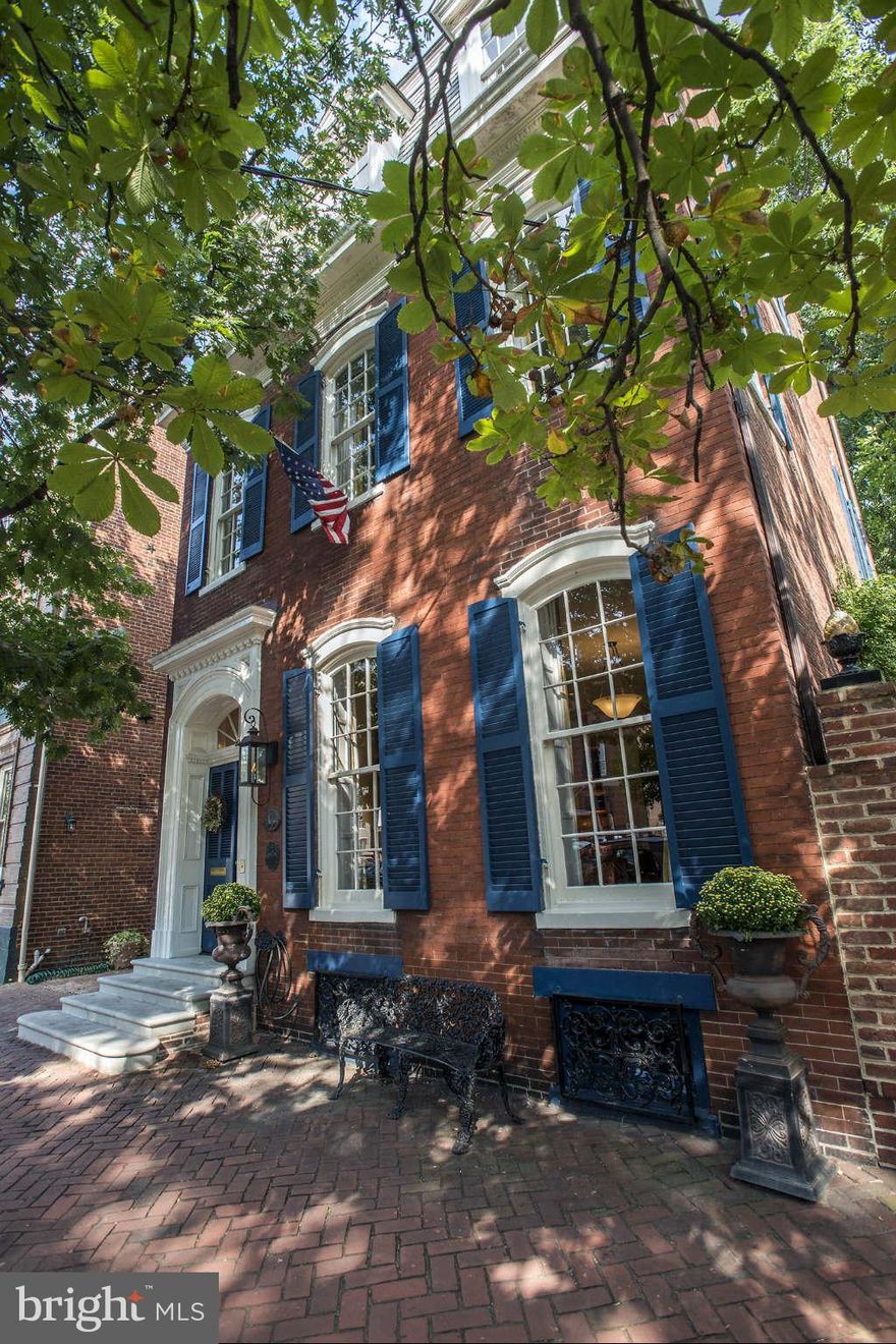 Elegant detach home in the center of Old Town C. 1880 with Dbl lot & off street parking.  Recently updated, this home features a beautiful crisp white chefs kit., opening to bright Family Room which overlooks the gardens.   Formal LR & DR w/ fireplaces are comfortable for today's lifestyle.  Large, very private master suite w/ spa like bath and steam shower.  Finished LL w. Wine Cellar, workshop.