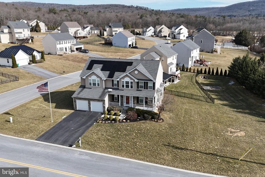 Welcome to this stunning Colonial home, In Upland Estates.  Let SUNNOVA SOLAR pay your electric bill!!  This beauty boasts over 3,000 square feet of above-grade living space. If you are looking for space to spread out  this is the one for you! Home has a traditional floor plan with a modern flare! This exquisite former model home is brimming with upgrades and exceptional features. With 4 spacious bedrooms and 3.5 baths, this property offers ample space and comfort for all. Step inside to find a main floor designed for both functionality and elegance. The open kitchen is equipped with modern appliances, granite counters, tall cherry cabinets with trim, and complemented by a breakfast room addition, creating a perfect space for gatherings. The family room, formal dining room, and formal living room provide a variety of spaces for relaxation and entertaining. The upper level is home to a magnificent master suite, measuring an impressive 17x20 feet. The ensuite bath features a soaking tub, separate shower, and a water closet toilet area, offering a private oasis within your home. The suite also includes a spacious walk-in closet. Three additional spacious bedrooms and a large hall bath complete this level, providing comfort and convenience for the entire family. The finished basement is a versatile space, featuring a large recreation room, a full bath, a huge storage room, and an at-grade walk-out. This area offers endless possibilities for use, from a playroom to a home theater and/or fitness space. Enjoy breathtaking mountain views while being conveniently close to local amenities. Easy drive to local shopping and only a 25 minute drive to Historic Gettysburg and 30 minutes to Liberty Mountain Ski Resort. This amazing colonial is also equipped with Sunnova solar panels! Let these panels significantly reduce your electric payment to a modest $9-$15 monthly OR often times the solar creates a credit in electric with no bill at all! The panels are financed with a small payment, resulting in a combined cost that is lower than typical usage expenses for a home of this size.  Finance Agreement transfers to the new owners to continue enjoying these great rates! At the end of the finance agreement the panels are fully owned by homeowner. Don't miss the opportunity to make this remarkable home yours, offering a perfect blend of style, comfort, and efficiency.