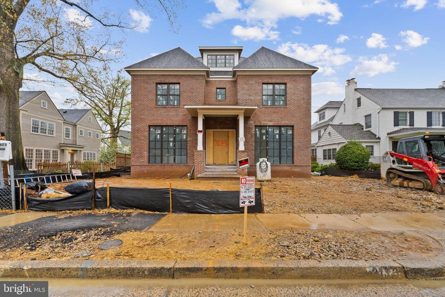 GOING, GOING, GONE! You'll be sad to have missed this one but we have 3 other properties available in Clarendon.  Situated on an idyllic, winding, tree-lined street in the sought-after Lyon Village, this classic brick home is NOW DRYWALLED- the perfect time to tour. Outfitted with top-of-the-line details such as white oak cabinetry, a telescoping door system, and impressive millwork, this residence perfectly blends location, functionality, and high-quality finishes for the most discerning buyer.

As you approach the home, you'll be welcomed by an inviting lead walk adorned with curved metal railings leading to a generous covered landing. Upon entering, a warm foyer greets you, featuring a wood inlay ceiling and herringbone flooring. To either side, you’ll find a color-drenched study and an elegantly trimmed dining room. The open switchback transitional staircase is complemented by a sleek, timeless metal railing system. The heart of the home radiates warmth. The kitchen boasts a combination of painted white and white oak cabinetry with quartz countertops and backsplashes. A paneled SubZero refrigerator and a Wolf range completes this dream workspace. The family room features sleek natural and minimalist stone fireplace surround flanked by full-height built-ins, and enhanced with a beamed ceiling. You can seamlessly connect the indoors and outdoors via a telescoping slider door, which links the screened porch and the family room.  A generous flagstone patio sits just beyond the screened porch.  Oversized black windows are thoughtfully placed throughout, flooding the main floor with natural light. This level also includes a moody powder room and butler's pantry and a functional mudroom with natural stone checkboard flooring. 

Ascend the striking staircase to discover four bedrooms, each with ensuite baths and walk-in closets. The primary suite serves as an idyllic retreat, featuring an elevated, beamed ceiling and expansive windows. 

Continue up to the bonus floor, which includes an open rec room, a full bedroom, and a bath. The lower level is perfect for relaxation and entertaining, featuring a large recreation space with windows and a spacious full bath, ideal for hosting gatherings of any size. For those seeking something more invigorating, an exercise room offers an optional sauna.  An additional guest suite is located on this level, as well. 

The exterior features a lovely, private backyard space with extensive flagstone patio space and a functional oversized detached garage with storage above. Additional options include the potential build-out of an elevator to connect all four floors (rough-in planned), a movie theater, sauna, and any other amenities that a discerning buyer can envision.