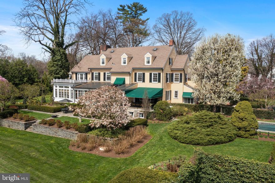 Situated on nearly 3 lush acres, 35 Deepdale Rd was built in 1904 and was one of the first manor homes built in Strafford. This 3 story home offers intricate millwork,  arched doorways, and exquisite period details. This home has abundant amenities, as well as a rich history that predates the American Revolution. Enjoy today’s modern conveniences, including additions and upgrades such as the sun room designed by the famed Archer & Buchanan Architecture Firm, a movie theater room outfitted by Main Line Sound & Video, a bar room custom designed and built by Village Handcrafted Cabinetry, gourmet kitchen, exercise room, inground pool, and tennis courts.
Behind a landscaped stone privacy wall, the brick-lined circular driveway leads you to the stately entrance of this 7 bedroom, 4 full, and 2 half bath home. This home offers the best features found in custom homes today, having undergone an addition in 2017 and extensive renovations in recent years.  However, it also retains many period details, including original hardwood floors, 10-ft.+ ceilings and 2 wood-burning, and 1 gas fireplace with period mantels and surrounds, as well as a flagstone porch. 
Upon entering the grand foyer, you are drawn to the views of the property. To the left, the dining room with built-in China cabinets opens through a French door to the terrace. A swinging door in the dining room leads to the original full service butler’s pantry. On the other side of the pantry, the kitchen and breakfast room are filled with natural light from skylights and large windows. High-end appliances include a Wolf double wall oven, Sub-Zero refrigerator, Miele dishwasher, GE built-in microwave, Décor cooktop and Shaw sink. The center island seats three. The kitchen has extensive custom cabinetry, including a built-in cabinet door to the 1,000-bottle wine cellar on the lower level.  A mudroom includes the first-floor laundry, and 1 of 2 first-floor powder rooms.
The formal living room, off the foyer, flows into an office/sitting room with woven grass cloth wallpaper. It also opens to the sunroom addition, built in 2017, which showcases vaulted coffered ceilings. A wall of windows overlooks the expansive rear yard, and French doors open to the flagstone terrace. French doors also lead to the family room with wood burning fireplace. The family room offers excellent entertainment opportunities, but is also perfect for a quiet night watching TV at home, with its adjoining bar room featuring a custom built 2 tiered, Alderwood bar with seating for six. Just off this room is the custom movie theater that offers leather reclining chairs for twelve, barstool seating for seven and a 133” x 56” screen.
Atop the elegant staircase, the second level includes the primary bedroom suite with hardwood floors, fireplace, vaulted ceiling and 2 walk-in closets. The primary bath has a dual vanity, glass-enclosed shower, soaking tub and separate water closet. A sitting room offers access to the upper-level laundry. The second level has 3 additional bedrooms, a home gym, and a full bath in the hallway and an office.  The third level offers 3 more bedrooms, 2 full baths and bonus room.
The gorgeous grounds have terraced gardens, statues, fountains, walking paths and seating areas. Extensive landscaping by Gale Nurseries adds to the beauty. You’ll also enjoy an inground pool, Har-Tru tennis court and the convenience of a detached, 3-car garage. Located in the top-rated Tredyffrin-Easttown School District less than a quarter mile from the Strafford Station with service to Phila. and NYC.
Adjacent to the historic Old Eagle School the residence was called “Sharraden”, named after the German immigrant who bought a 150 acre parcel for farming in 1765. This 8,477 sq ft home was the country estate of Gertrude Gouverneur Clemson Smith, once Katherine Hepburn’s mother-in-law. Today the historic school hosts many neighborhood events. Inspection report as well as floor plans in document section.