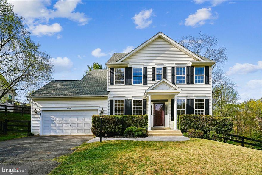 Welcome home to timeless comfort and scenic charm in the sought-after Falls Wood community of Round Hill. Perfectly positioned on a picturesque 1-acre lot, this lovely four-bedroom, three-and-a-half-bath colonial offers the ideal blend of classic style, modern updates, and peaceful outdoor living—all with no HOA.

Step inside to discover hardwood floors that flow throughout the main level. The inviting foyer is flanked by a formal dining room adorned with crown and chair rail molding as well as architectural columns—perfect for hosting gatherings—and a versatile flex space ideal for a home office, den, or additional living area.

At the heart of the home, the open-concept kitchen features warm oak cabinetry, stainless steel appliances, and propane gas cooking, seamlessly connecting to the spacious family room. Here, you’ll find a cozy propane gas fireplace, ceiling fan, and direct access to the expansive custom deck—an ideal setting for entertaining or simply unwinding while taking in serene views of the  backyard and the gentle creek beyond.

Upstairs, retreat to the peaceful primary suite complete with a tray ceiling, ceiling fan, walk-in closet, and an en-suite lux bath featuring dual vanities, a soaking tub, walk-in shower, and private water closet. Two additional bedrooms and a well-appointed full bath complete the upper level.

The fully finished walkout lower level expands your living space with a generous recreation room, fourth bedroom, and a third full bath—perfect for guests or multi-generational living. Additional highlights include a dedicated laundry and storage area, plus a separate utility room for added convenience.

Ideally located with easy access to Route 7 and just minutes from the shops, dining, and charm of both Round Hill and Purcellville, this home offers the perfect balance of tranquility and accessibility.

Recent updates provide peace of mind, including a roof (2021), HVAC (2018), water heater (2024), and sump pump (2024).

This is more than a home—it’s a lifestyle.  There truly is no place like home.  **PRO PHOTOS COMING SOON!!**