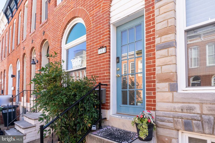 A Baltimore Classic - with parking and a multi-level rooftop deck! Come home to the heart of historic Federal Hill and into your beautiful 2BR 2 Full Bath home with both charm & modern updates throughout. Step inside a tiled vestibule, perfect for off-street package delivery, and enter your light-filled living room with hardwood floors, solid moldings and a bay-front window, featuring a newly installed half-moon transom. A spacious dining area with a reclaimed wood shelf leads you into an amazing kitchen full of warmth & character with exposed brick, a tin ceiling, stainless steel appliances, including a (2023) refrigerator and new gas range, disposal, faucet and ceiling fan (all in 2024-2025), and granite counters. Off the bright, cheerful hallway leading to the back door you’ll find a stylishly remodeled full bathroom and the much sought-after main level laundry. Upstairs has new luxury vinyl plank (LVP) flooring, two generous bedrooms, plus a flexible office or bonus area, off the primary bedroom, separated by a reclaimed wood barn door. The primary bath with a skylight has been fully renovated with a beautiful tub-shower combo tiled in porcelain! Access to the home’s lower level, off the dining room, is a completely rebuilt custom wood stairwell & staircase leading you to plenty of usable space & storage. The well-maintained basement has replacement windows, walls that have been recently sealed and painted, floors updated with self-leveling concrete and painted, new ductwork, rerouted piping, and additional electric outlets. There is ample space to create a workout area, comfy TV or play area, along with plenty of storage! Out back, enjoy a custom brick patio with privacy fence, a newly covered area for grill & seating, and a deep parking pad with a retractable privacy screen. A reinforced and newly stained double-tier deck offers city views and a canopy-covered rooftop level, accessed by a sturdy black iron spiral staircase. Additional important updates include a new water heater with expansion tank (2024), new furnace (2024), and a new air condenser (2024). All this and when you see this home... you’ll LOVE it!