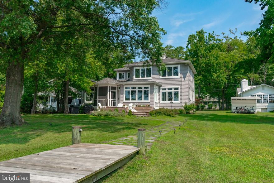 Don't miss this renovated contemporary  waterfront home on Fishing Creek with 150 feet of waterfront and great waterview's just minutes from The Chesapeake Bay!  Protected pier with two slips (one with 16,000 lb. boat lift), electric, water, lights  and new pilings completed in 2018. First floor renovation completed in 2019 includes kitchen with silestone counters, white cabinets, all new SS appliances, open floor plan, refinished hardwood floors, new windows on waterside of house. Fabulous Ipe deck on waterside with fire pit feature built in 2017.  First floor bedroom suite, primary suite on 2nd level with sitting room/office  could be converted to additional bedroom that would bring total number of bedrooms to four. Oversized garage and two driveways. One for cars and another for boats/additional vehicles. Vibrant community of Arundel on the Bay offers community beach, pier, boat launch and many activities.
Tax record square footage is incorrect.