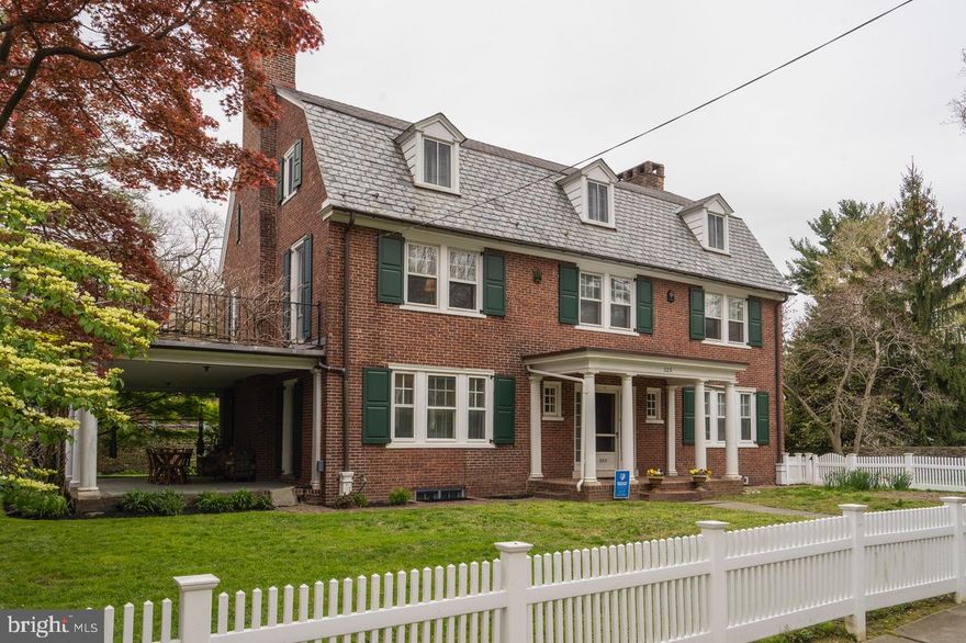 Location, Condition, Space and Natural light--all combine to make one of the most beautiful residences in West Mt Airy.   With 6+ bedrooms and 3 1/2 baths, 225 West Nippon Street, c.1907,  sits on a 1/4 acre lush landscaped lot on an off-the-beaten-path road that is in walking distance to almost everything Mount Airy.  The 3-story brick colonial offers early 20th century detail with a singular and flexible floor plan:  1st FLOOR:  Covered entrance into a broad and welcoming center hall; powder room and coat closets on either side; Living room stretches from east to west to capture natural light all day boasting a wood-burning fireplace with handsome painted mantel, dentil molding detail, and Mercer tile hearth, and a door on either side leading to the side porch, and it provides space at one end for a sizeable dining room table and chairs;  a cozy extra room off the center hall offers a  private reading spot or small 1st floor office with its own exit to the back yard; On the other side of the center entry hall is a surprise!  A successful 2014 renovation created a most appealing combination family room and cook's kitchen that invites one to be comfortable in all seasons in the family room and warmed by the gas fireplace in winter.  The serious cook in the meantime can revel in high end kitchen with quartz counters, ceramic tile backsplash, abundant cabinetry, center island, gas cooking, deep sink with garbage disposal, dishwasher, stainless steel side-by-side refrigerator/freezer, and 45 bottle wine cooler.  A mini-split keeps both rooms cool while glass doors and Pella casement windows let in natural light;  Off to the side of the kitchen is functional space providing pantry storage and front loading washer and dryer topped by a quartz folding table.  The kitchen leads to private rear patio.  2nd FLOOR:  Large bedroom with closet in south-facing corner of the house has door leading to a roof balcony that is seasonally draped in wisteria; 2nd bedroom with fireplace and built-in storage shelving is currently used as an artist's studio; Hall bath with ceramic tile floor and subway tile surround with shower over tub; Long hall includes two hallway linen closets and leads to a spectacular main bedroom suite renovated in 2008-2009:   large bedroom, a 2014 renovated main bath with amazing 66" soaking tub with shower, room-sized walk-in closet with center island and vanity, and private reading nook overlooking the gardens.  3rd FLOOR:  A flexible plan that accommodates 4 bedrooms and a bath and attic storage OR two bedrooms, a work-out room, an at-home office and storage. You decide!  BASEMENT:  Full, unfinished, high-ceilinged, for utilities, storage or work areas.  Fully water-proofed by BQ Basement in 2020 with french drain, sump pump, back-up battery and transferable warranty.  Two 2015 gas-fired Sila furnaces, 75 gallon gas-fired domestic hot water heater, 200 AMP circuit breaker electric service, high-velocity central air cools the 2nd and 3rd floors, Original slate roof on lower pitched surfaces with asphalt shingle at top.  Over-sized one-car garage with loft storage above.  Gardens are filled with colorful perennials and mature shrubs.  Location:  on a one-way quiet street in a diverse community of all ages, connected by a Google list-serve, seasonal celebrations and the convenience of the Allen Lane commuter train station just steps away.  Condition:  exemplary.  Space:  4,243 square feet with high ceilings and delightful architectural detail.  Natural light:  broad double hung and casement windows along with glass french doors, a wall of glass at the back of the kitchen, windows that wrap around the reading nook of the main bedroom, the bank of windows that light up the dining table--all contribute to a sense of well-being that pervades this lovely home.  Seller prefers settlement after July 31, 2022.  Showings start Saturday, 5/7.