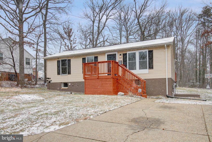 * OFFER DEADLINE: MONDAY, 01/22 @ 5:00 PM - PLEASE SUBMIT ALL OFFERS BY DEADLINE * Introducing this exquisite two-level rambler, perched on a sprawling and flat 25,000 square foot lot, is meticulously renovated to perfection, with 3 bedrooms, two and a half baths, and an additional lower-level guest room boasting over $20,000 in upgrades. Beyond the stunning facade lies a home that seamlessly blends modern luxury with timeless elegance. Step onto the front and rear decks, both freshly stained, offering the perfect outdoor spaces for relaxation and entertainment. The home features brand new front living room and master bedroom windows, and a private two car driveway that has been freshly pressure washed. The entire home has received a fresh coat of paint, enhancing its curb appeal. The heart of this home is its renovated kitchen, boasting brand new long ceramic tile flooring, granite counters, stainless steel appliances, and contemporary cabinets. A French-style door opens to a vast deck, creating a seamless transition between indoor and outdoor living. The living room is adorned with gleaming engineered cherry wood floors, 6-panel doors, and recessed lights, creating a warm and inviting atmosphere. The primary bedroom, spacious and elegant, features engineered cherry wood floors and a full ensuite bath with a shower, ceramic tile floor, and a new vanity. The main hall full bath features a tub/shower, ceramic tile floor, and a new vanity. Two additional bedrooms on the main level continue the theme of sophistication with engineered cherry wood floors. The walk-out basement is a haven of comfort, with brand new carpet on stairs, a large recreation room showcasing ceramic tile floors, French-style doors to a side entrance/exit, and recessed lights. The laundry closet includes a washer and dryer for added convenience. The lower level also boasts a guest room with updated wood-look gray ceramic tile flooring, a closet with 6-panel doors, and a window for natural light. A bonus room, which could serve as an office or den, features a closet with 6-panel doors and updated wood-look gray ceramic tile flooring. The half bath on this level boasts a ceramic tile floor and a new vanity. Exterior features include a new drain installed outside, a freshly painted large shed with a newer roof (installed within 3 years), a concrete court with a basketball hoop, a newer HVAC system, newer roof with gutter guards (installed within 3 years), and a brand new hot water heater. Conveniently located near schools, parks, shopping, and restaurants, as well as the College Park and New Carrollton Metro stations and major commuter routes such as BW Parkway and I495, this property is not just a home; it's a lifestyle. Don't miss the opportunity to own this masterpiece that seamlessly combines modern amenities with classic charm.