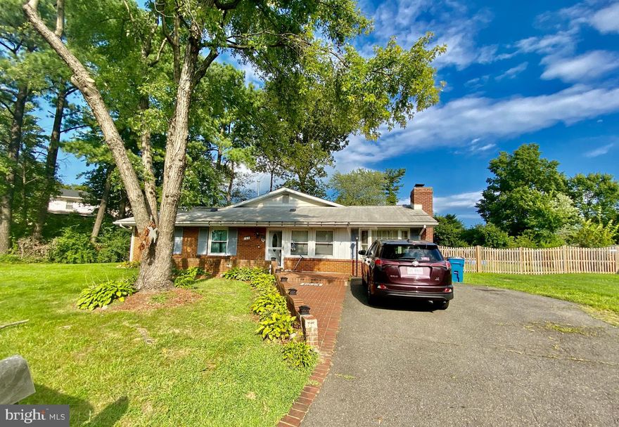 Spacious All-Brick Rambler with addition that Doubles original house size! Lots of Options! Open Floor plan Kitchen with Granite Counters, newly fresh painted cabinet, Breakfast Bar, Den with  stone Wall & Woodstove, Large Family Room, Home Office Area, Master bedroom with Private Bath, freshly  painted and  new flooring throughout the living room and bedrooms,  Mud Room walks out to Big Fenced Back Yard with Shade From Mature Trees, huge garden area, storage shed & more!