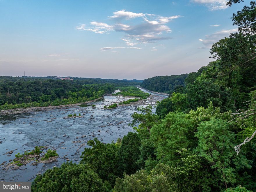 Experience direct riverfront living at its finest with this exceptional estate opportunity, boasting a prime location on one of Washington's most prestigious streets and offering breathtaking views of the Potomac River and the dramatic waterfall which traverses the river.  Encompassing nearly two and a half acres which runs directly to the water's edge, this unique estate is introduced by a gently winding drive leading to an existing nearly 6,000 sq. ft. residence. The estate presents an unparalleled opportunity to customize or build a new riverfront estate.
The current residence includes four spacious bedrooms and five full baths, including the expansive main level primary suite.  The innovative design was designed to maximize the expansive river views with floor-to-ceiling windows across the entire main and upper level. Four fireplaces and a richly paneled library set the stage for a home which easily accommodates both large scale entertaining and a deep connection to the exceptional natural environment.  The existing home's unique design is particularly evident on the expansive outdoor terrace, which reveals unobstructed, 180 degree views of the Potomac River.
Located less than ten minutes from both Washington, DC and Tysons Corner, Virginia, this estate's location is second to none. Surrounded by many of the region's most exclusive properties, 1159 Crest Lane offers a rare opportunity to create a riverfront estate of uncompromising luxury.