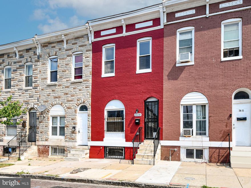 Located on a beautiful and historic brick road, this charming row home has been completely renovated to suit a modern lifestyle. The open floor plan includes a flow through living and dining area, a functional kitchen layout, and first floor powder room. The inviting eat-in kitchen features newly installed stainless steel appliances, granite countertops, tile backsplash, wooden cabinetry, gas stove/oven with over the range microwave and a brand new deck. Rooms are bright and sunny. A stunning staircase leads to the upper level which features sizable bedrooms, bathroom with hall access. Gleaming hardwood flooring throughout the main and upper levels. The basement is fully finished and features a bedroom, full bathroom and laundry room.  The roof, plumbing, electric, and HVAC systems were all newly installed during the renovation. Host a BBQ or cookout in your private fenced backyard. The backyard features a large patio area that is easy to maintain and could double as a parking pad. Many public transportation and ride share options are available nearby. Enjoy all that the city has to offer! Just a short distance to the Downtown Inner Harbor, Penn Station, Johns Hopkins Hospital and University, Morgan State University, and MICA. This home is close to schools and several amenities including shopping centers, museums, and restaurants. 2608 East Oliver Street is eligible for several grants and incentive programs. Won't last.