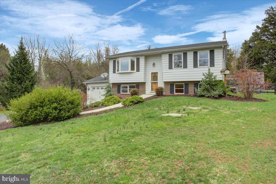 This charming rural traditional split-level home is located in Keedysville, MD.  The property sits on a picturesque one-acre lot surrounded by historical landmarks.  The open-living space on the main level offers new flooring and new appliances throughout the kitchen.  The roof was replaced within the last 3 years. The fully finished basement includes a lower-level bedroom and full bath, providing extra living space or guest accommodations.   This home offers a new hot water heater, a water softener, UV light, and water filter.  The large one car garage offers convenient parking and storage.  The spacious fenced yard offers a deck for relaxing and enjoying the serene views.  This home combines modern comforts with historic charm, making it an ideal setting for those who appreciate country living with easy access to history and nature.  This home is move in ready and waiting for its new owners.