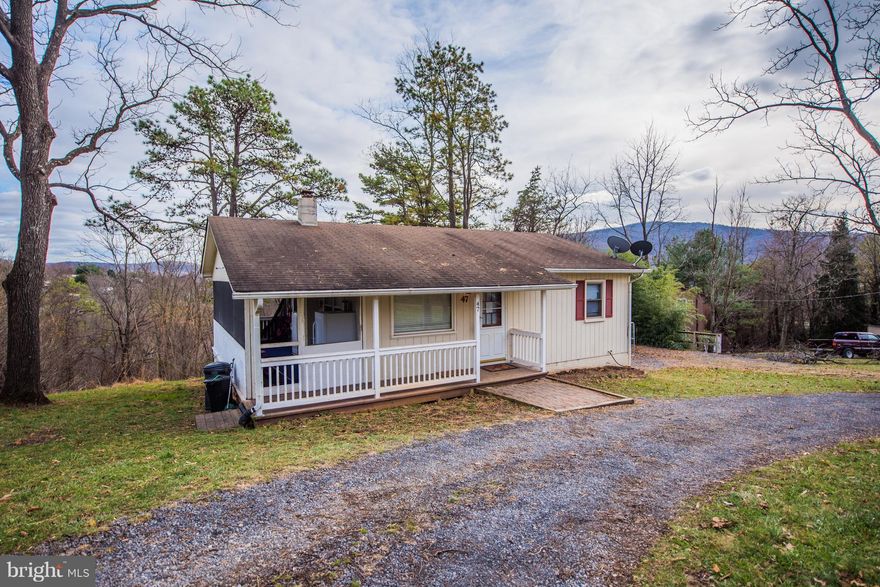 Great location - just minutes away from I-66 at Linden, Route 55 and the town of Front Royal.  A lush acre surrounds this delightful home that is perfect for year round or vacation living.  The main level features an open living/kitchen area with doors to the covered side porch, 2 bedrooms and a full bath.  The lower level offers family room, bedroom with walk-in closet and a half bath that needs minimal finishing to be a full bath with shower.