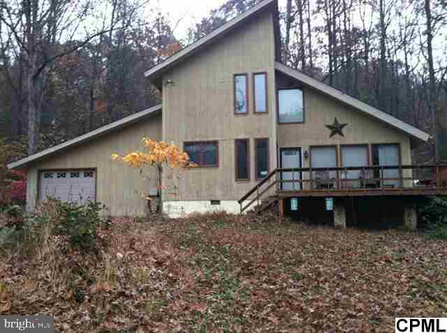 The house has a beautiful view of Shermans Creek with over 450 feet of creek frontage. Excellent for fishing, hunting and privacy. The house and buildings are located on top of the hill, 50 feet elevated above the creek. There is a large out building 40X60 with multiple uses - storage, ideal for a shop, etc. Outside wood burning furnace for both home and pole barn.