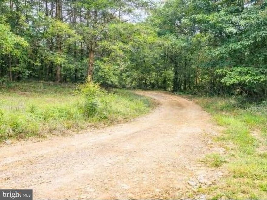 Tucked away in a peaceful rural setting, this beautiful 2-acre lot offers the kind of space and privacy that’s becoming harder to find. Surrounded by open skies and the quiet charm of the countryside, it’s the perfect place to bring your vision to life—whether you’re dreaming of building a custom home, creating a private retreat, or simply investing in land for the future.

This property is already equipped with electric, a well, and a septic system in place, offering a valuable head start for your plans. It has also been appraised, providing added confidence as you explore the opportunity. 

Lovingly enjoyed by the same family for years, this property has been a special gathering place filled with camping trips, laughter, and time spent together. A pavilion with a fireplace still stands, creating the perfect spot to relax, entertain, and take in the peaceful surroundings - now it's time for another owner to enjoy this special space!

If you’ve been searching for a private setting with meaningful history and endless potential, this is a place where new memories are ready to be made.

Professional photos to come.