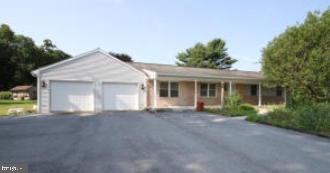 Large ranch with 4-5 bedrooms on 1/2 acre country lot. There are replacement windows throughout and newer vinyl siding. Attached garage could easily store 4-6 cars. There are various rooms which could accommodate 4 or 5 private bedrooms or an office. There is a large main floor laundry room and also a master bedroom with own bath. Flat private rear yard.