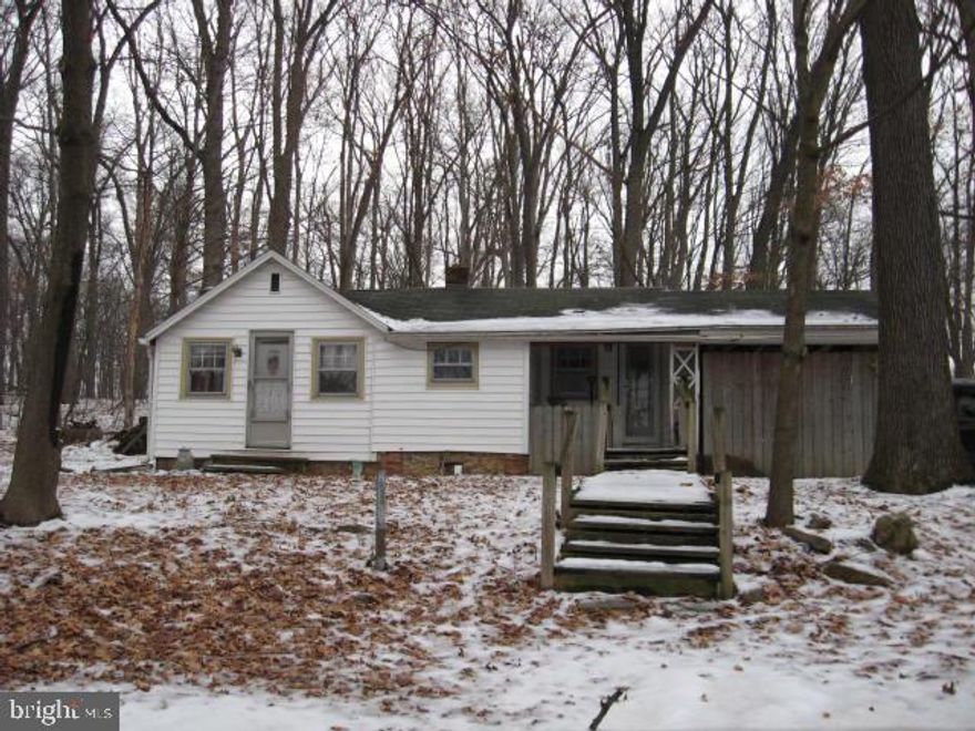 Siding covering original log cabin.  Nice cabin in the woods.  Low ceilings.  Close to Lake PaHaGaCo.  Needs work, possibly heat and plumbing, reflected in the price.  Being sold "as is".  BE CAREFUL IF RAMP IS WET.  VERY SLIPPERY.  WALK THROUGH YARD TO PORCH.