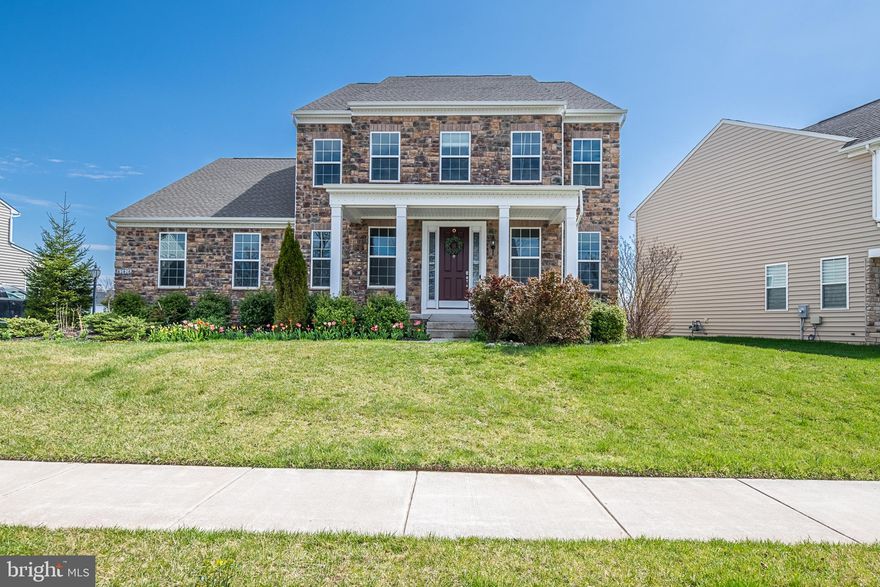 WELCOME HOME! This Single Family Home located in the Nicholson Farm community boasts 4000+ sq. ft. finished space with modern floor plan. The covered porch in front, with stone, is perfect for sitting and enjoying your morning coffee or an afternoon tea. Walk inside to a formal living room and dining room. The family room offers a custom stone fireplace, perfect for snuggling during the cold winter months. Checkout the upgraded gourmet kitchen with soft close cabinetry, large custom island that offers tons of extra seating, stainless steel appliances, butlers pantry with custom backsplash.   The bright and spacious sun room, off the kitchen, offers tons of windows so you can take in the views of the maintained common area. Working from home, or the kids need a study area? There is a perfect office space off the family room that features granite countertops and cabinets for additional storage.  The main level also features a bedroom that can also be used for an additional office, play area/flex space. Head up to the upper level and take a peak at the primary bedroom. You will not believe the size of the walk-in closet and all the space it has to offer. The en suite primary bathroom has a custom tiled walk in shower with bench, 2 vanities and a linen closet. Bedroom 2 & 3 share a jack and jill bathroom. Bedroom 4 offers an en suite bathroom. The laundry room on the upper level also offers extra space for storage.  The backyard features an in ground sprinkler system and offers plenty of space for making memories.