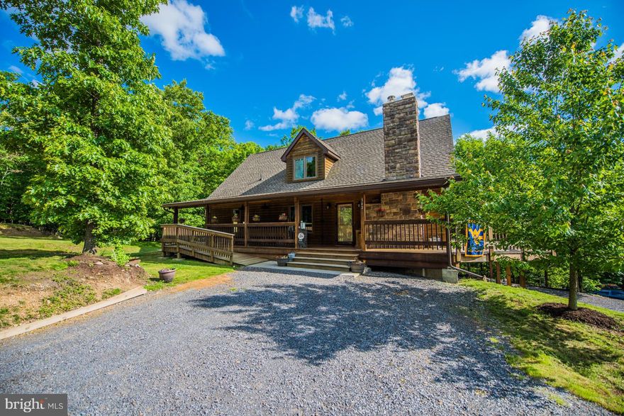 This is a gorgeous property with everything you want along with a fantastic view. Cedar Chalet on 2.318 acs. Open floor plan with beautiful wood floors and ceilings, quartz counters in Kit, MSBR with sep..tub, sep. laundry room. Upper level family room overlook, bedroom, bath and office. Plus detached heated garage with studio/office above with all wood finish.  Ball Field. Private and secluded.