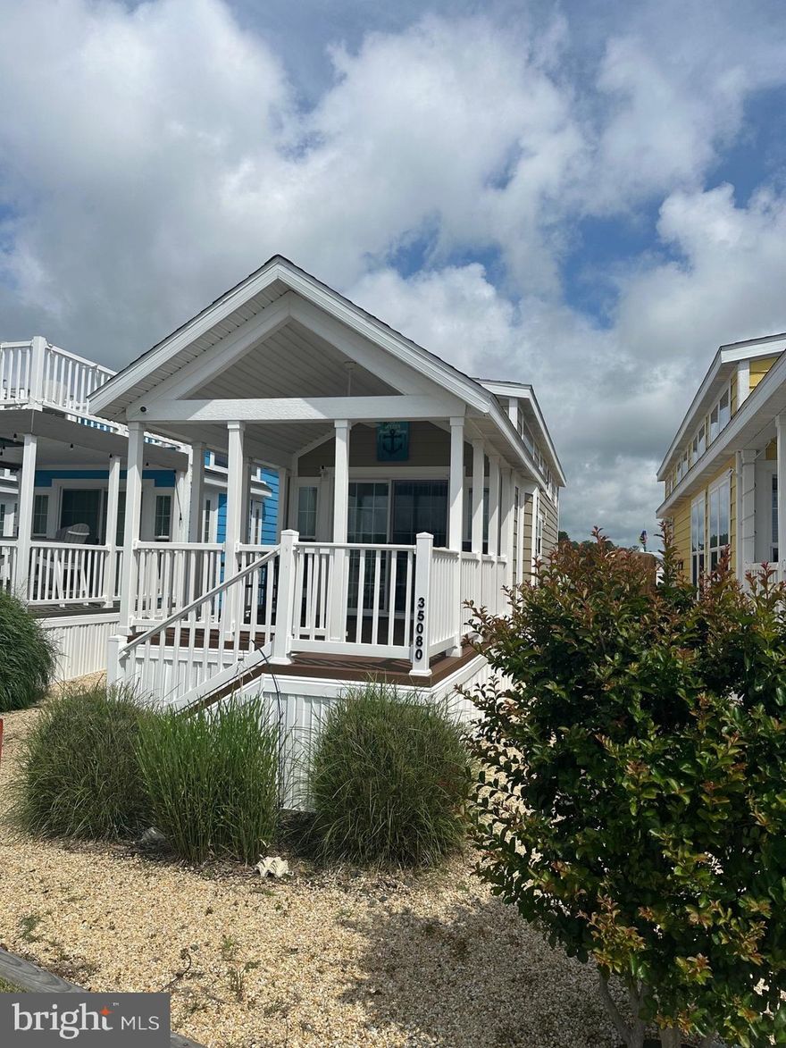 Welcome to West Bay – Your Perfect Seasonal Retreat!
Discover this charming Park Model Tiny Home, ideally situated beside the marina with breathtaking views of Rehoboth Bay. This seasonal getaway features a spacious covered porch overlooking the water—perfect for relaxing or entertaining.

Inside, enjoy a cozy living area, a fully equipped kitchen with full-size stainless steel appliances, and thoughtful touches like an outdoor shower and a storage shed with electric and lighting. The main bedroom offers a comfortable queen-size bed, and two additional loft spaces provide room for extra guests.

Available for seasonal use from April through October, this home comes with a seasonal lease of $7,072, which includes water, sewer, and trash service. Enjoy a summer of serenity and scenic beauty in West Bay—where exceptional views and a vibrant waterfront lifestyle await!