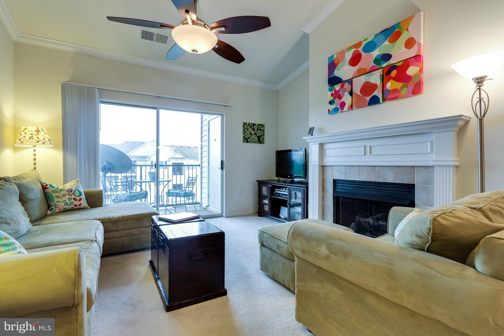 GORGEOUS! On Top Floor, Soaring Cathedral Ceiling, Gas Fireplace & Private Balcony. Generous kitchen: Ample storage (including pantry!) & gas range. 2nd Bedroom spacious enough for office / guest room. Bright Master BR w/ walk-in closet. Dual sinks in large bathroom. In-unit washer & dryer. Community amenities: Pool, gym, community ctr & party room, tot lot. Great condition. Reserved parking space