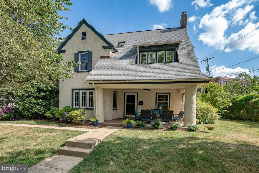 This South Wayne home is the epitome of charming, yet has the advantage of larger room sizes and entertaining spaces. Historic in its feel, it is modern in every respect and much larger than it looks from the street.  Stopping first at the amazing, welcoming porch with its accurate "haint" blue ceiling, enter into the inviting informal living room with original beamed ceiling and cozy wood burning fireplace, the perfect setting for a book or a conversation. The adjacent traditional, wainscoted dining room offers a light-filled space for family gatherings. A large addition in the back of the home provides an oversized family room/entertaining area open to the gourmet kitchen, which includes granite counters, a Subzero refrigerator, Viking range, beverage fridge, custom cabinetry and a huge island accommodating both prep and eating areas. 
Upstairs in the new area is the separately-zoned primary bedroom with walk-in California closet. A beautiful ensuite bath welcomes with subway wall tiles, basket-weave floor tiles, double sinks, marble countertops, underfloor heating and a spacious stall shower. Also part of the major renovation, the nearby hall full bath includes a laundry area. This room has underfloor heating, wood-look ceramic floors and a tub shower. There are 3 additional large bedrooms on this level, all benefiting from light from replacement windows, as well as another convenient full bath.  Two more good-sized bedrooms/office areas are located on the 3d floor, along with a half bath.   This home has historically accurate interior paneled doors, a newer roof, and a brand-new Crown boiler.  There is a 2-car detached garage with electricity and loft storage. All windows are either Pella Architectural Series or Proline with low-E coatings. The yard is completely private, surrounded by hedges and graced by specimen trees, yet you are only a few blocks from two schools and all the amenities of the town of Wayne. Residents of South Wayne know it  is one of the best places to live on the Main Line. This is a special home just waiting for a special new owner.