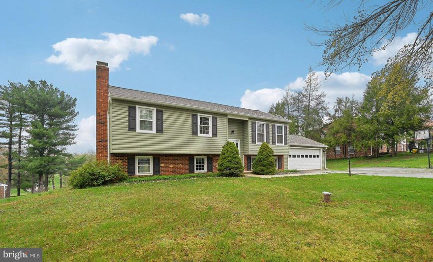 Welcome to this beautifully updated split-foyer home that blends comfort, style, and outdoor living. With 4 bedrooms, 2 full bathrooms, and a thoughtfully designed open floor plan, this home offers both function and flexibility for today’s lifestyle.

Upstairs, you'll find hardwood floors that flow seamlessly through the living room, dining room, and updated kitchen, creating a bright and cohesive living space. The kitchen features modern finishes, ample cabinet space, and a layout perfect for cooking and entertaining. Three bedrooms and a full bathroom complete the upper level.

Downstairs, the fully finished lower level offers a cozy family room with a fireplace, perfect for relaxing evenings or hosting guests. You'll also find a fourth bedroom, an additional full bathroom, and convenient access to the attached 2-car garage.

Step outside to your own private oasis—an expansive deck overlooks the inground pool, offering the perfect setting for summer gatherings, quiet mornings, or evening swims under the stars. The property is positioned to take full advantage of breathtaking sunset views, making every day feel a little more special.

This home has it all—modern updates, generous living space, great outdoor features, and a welcoming layout that fits any lifestyle. Don’t miss your chance to enjoy the perfect blend of indoor comfort and outdoor enjoyment!