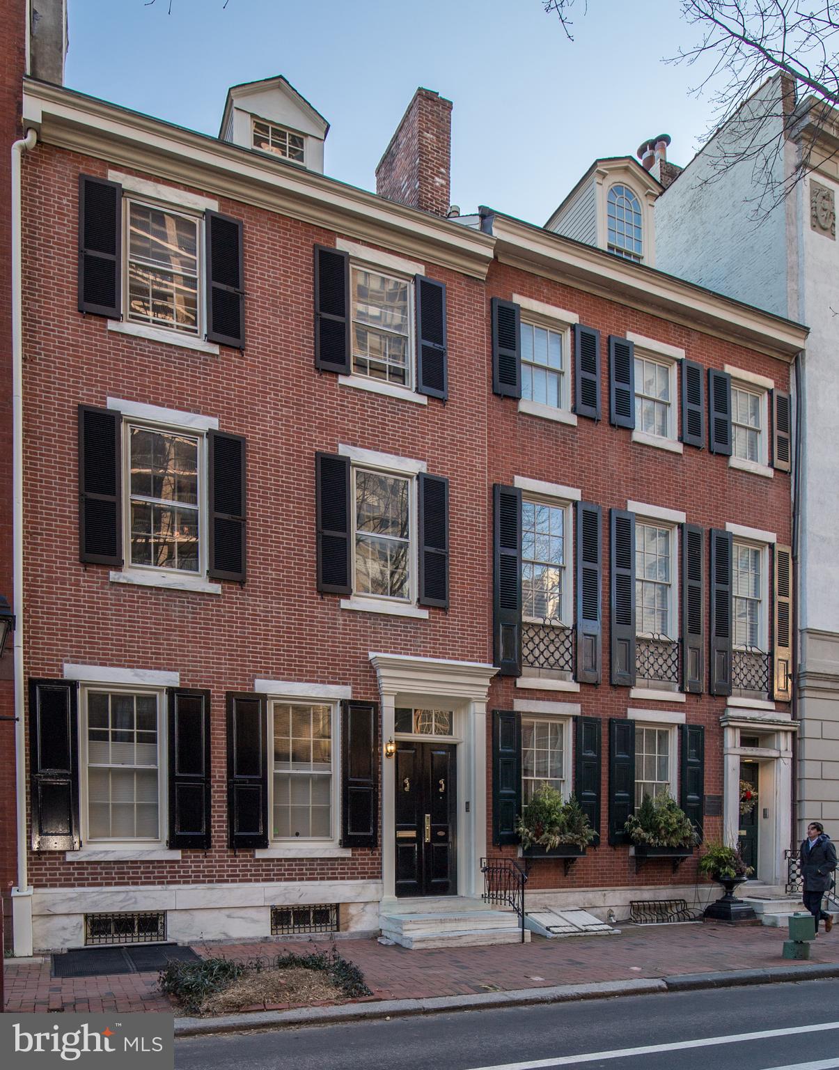 Stately and immaculate 4-5 bed, 4.5 bath newly renovated Society Hill home located on one of the finest tree lined blocks in Philadelphia. This elegant home features gorgeous detailed moldings, grand ceilings, tremendous light and plenty of living space for all your needs. Be greeted by the handsome, restored historic brick facade with shutters and marble steps. Grand double doors lead into the elegant foyer with a soaring ceiling, detailed moldings, architectural pillars and marble floor. Relax in the sophisticated living room featuring a non-working fireplace with marble and wood mantle and 2 large windows. Host parties in the dining area, which offers a non-working fireplace, pristine crystal chandelier and French doors to a charming, picturesque red brick garden. The handsome kitchen entices any chef with its white cabinetry, granite countertops, stainless steel appliances, marble tile backsplash, 3 large side windows, and ceramic floor. The bar counter opens to the classic breakfast area with dramatic floor to ceiling window and glass door to rear patio. Grand circular staircase leads up to the 2nd level. Open foyer with unique domed skylight allowing brilliant light to flow throughout this lovely home. Beveled French doors into the inviting library with an elegant bay of windows, built-in shelving and architectural pillars. From the hall you'll find a laundry closet for your utmost convenience plus a full bath. The master bedroom suite offers ultimate comfort with a non-working fireplace and seemingly endless storage space with 2 walk-in closets, 2 double closets and a linen closet. The all-new master bathroom is to die for! Enjoy soaking in your elegant claw foot tub while taking in the southern sunlight from the large window above, just one of the features of this classy bath. You will love its marble tile floor, half wall wainscoting, double vanity with marble counter top, heated towel rack and spacious all-tile stall shower. Wood steps lead to the 3rd level where you'll find 2 sun-filled bedrooms and a gorgeous all-new bath. Steps take you up to a dormer studio suite with skylight allowing tremendous light, exposed brick wall and private bath. The basement is ideal for all your storage needs, while also hosting the mechanicals (multi-zoned gas and electric heating throughout). Offering 1 year prepaid parking at Independence Park (half block away). Don't miss your chance to enjoy classic luxury and modern elegance at its finest!