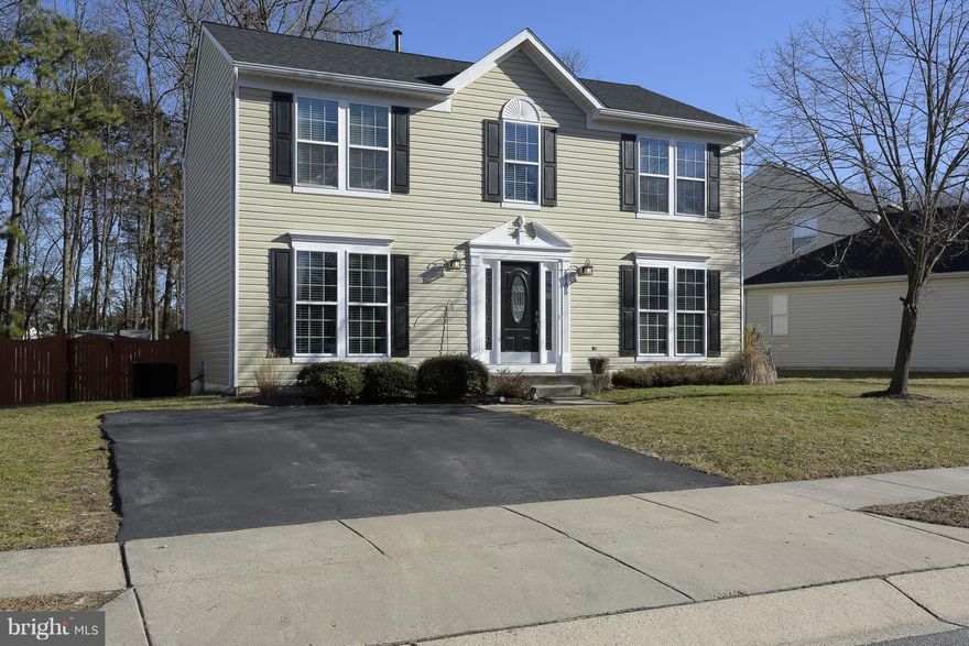 This is the one! Updated colonial located on a premium lot backing to trees! Features HW floors on main level, plantation shutters, NEW carpet, & NEW roof (17). Gourmet eat-in KIT w/ center island, pantry & granite counters! Fully fin basement w/ huge recreation room, full bath, & storage! Fully fenced (6' fence) with large deck & brick patio - perfect for entertaining! Quiet cul-de-sac location!