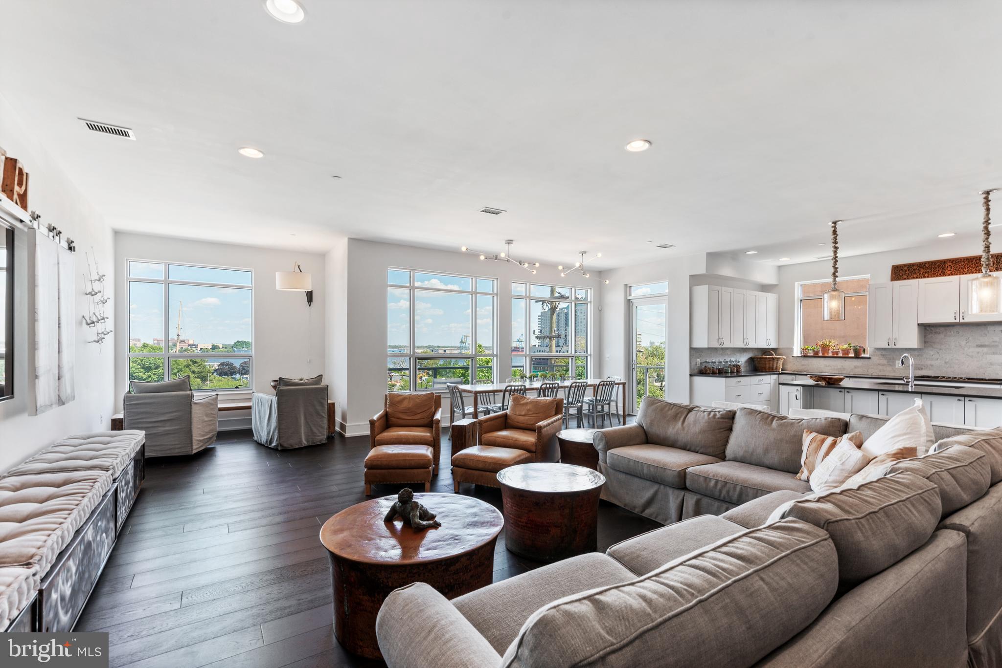 Welcome home to Unit 303 at 410 S Front Street: This corner location, sun drenched condo defines luxury in every aspect! Boasting 2,177 square feet of living space, which is larger than the other 2 Bedroom, 2 Bathroom units in this 55 unit building and the only 2 Bed + Den Unit with a view of the garden from the back balcony. This condo features 2 large, light-filled bedrooms and a flex-space den that can be converted into a personal yoga studio, workout room, or an in home office. Located on the 3rd floor of the building, this single level condo has the most breathtaking views of the river from the front balcony, along with romantic views of the garden from the second balcony off the master bedroom. Upon entering, enjoy a grand entrance way that leads into the state-of-the-art kitchen with Custom Center Island Storage Cabinets, Gaggenau Kitchen Appliances, and large windows that invite the perfect amount of light. The grand room is fit for the host that enjoys large soirees, allowing for over 30 people to gather and relax! The balcony off the grand room allows for guests to sit comfortably as they enjoy the views. The Master bedroom is much like a private oasis with a balcony overlooking the gardens, a luxury soaking tub in a marble drenched bathroom, and a massive walk-in custom closet. The guest bedroom also overlooks the gardens and features large windows in a sun filled space. The bedrooms include custom automated shades which allow minimal light and create a comfortable nights sleep. There is no lack of convenience, INCLUDED are 3 secure parking spaces that have direct access underground and the ability to remotely open the garage from the comfort of your gorgeous home, along with a 24/7 front desk concierge & doorman.
Storage will never be an issue with two grand coat closets at the entry, a great room storage closet, private secured storage unit in the garage, and the most incredible built-in walk-in closet in the master bedroom. With a nominal HOA fee, the building is Pet Friendly and includes an Outdoor Rooftop Patio Lounge with 360 degree views, a Community Garden with Fountain, fully equipped meeting room, and a professionally managed civic association. Enjoy 4.5 years left on the property tax abatement, ease of quick access in and out of the city, and direct access to The Shambles in New Market. Capture all that luxe city living has to offer in this fabulous condo, and schedule your private tour today.