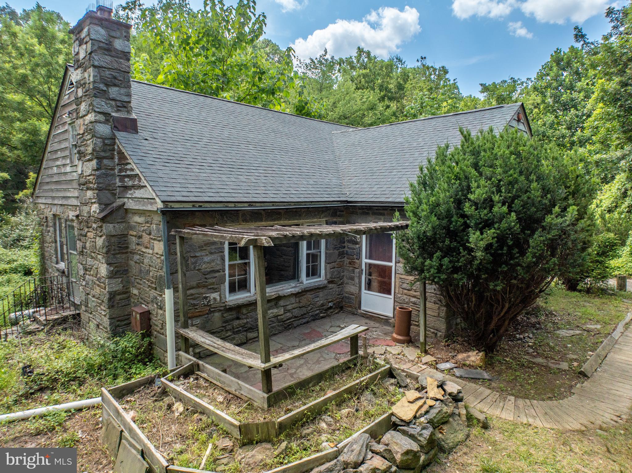 Don’t miss this rare opportunity to bring your vision to life! Tucked away on 3.33 wooded acres with over 800 feet of frontage along scenic Chester Creek, this Middletown Township property is the perfect canvas for creating your dream home. While the existing home requires restoration, the potential is unmatched — the lot, setting, and location are truly one of a kind. Imagine waking up to the sounds of nature, just steps from the Chester Creek Trail’s entrance and less than a mile from Linvilla Orchards, a favorite community destination offering year-round events and seasonal fun. Other location highlights include convenient access to public transportation, close proximity to Media Borough — affectionately known as “Everybody’s Hometown” — and an easy commute to Philadelphia. This property is located within the Middletown Township Floodplain Conservation District — any improvements requiring permits must comply with Zoning Article XXIX. Property being offered in "as-is condition", Buyer responsible for U&O cert and any required repair. Seize the opportunity to restore or reimagine this peaceful retreat and make it your own!