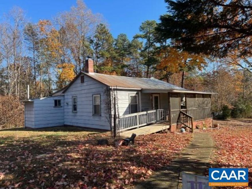 Two bedroom, one bath bungalow.  Screened in porch.  Multiple out buildings.  House needs work but is in livable condition.  Property sold "as-is".,Wood Cabinets