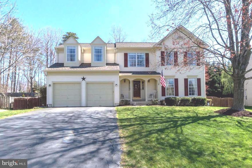 Don't miss this stunning colonial in "The Manors" of Park Ridge! This home is gorgeous with hardwood floors throughout the entire house, newly upgraded gourmet kitchen with granite counters, custom soft close cabinets,  built in pantry, pendant lighting,  stainless appliances, tiled backsplash, bar area, breakfast nook with relaxing  window seat to sit in the morning sun!  Step down in to a spacious sunken family room with vaulted  2 story ceilings, and brick fireplace with mantle.  The family room leads out through A new Anderson Sliding glass door to a large deck for entertaining and a fully fenced yard which backs to trees!   Spacious living room and dining room with chair railing and hardwood floors. Freshly painted powder room with upgraded sink and fixtures.  Upstairs you will find a grand master with bump outs ,and vaulted ceilings!  Master bath has huge soaker tub, dual granite counter top sink, and separate shower! Additional bedrooms are oversized with large spacious closets, vaulted ceilings and hardwood floors! Upstairs hall bath has ceramic tile, updated lighting and fixtures!  Basement is spacious, with space for rooms, and rough in for plumbing!  Other features include like new hot water heater, Gas Furnace and heat pump! Newly updated fixtures and lighting!  Ceiling fans throughout! New 2" wooden blinds on all windows! New architectural roof, Privacy fence has 2 gates and this home has an  ADT security system!  So close to shopping, I-95, commuter lot, and just minutes to Elementary, Middle and High school!  Don't miss this home it will not last long!