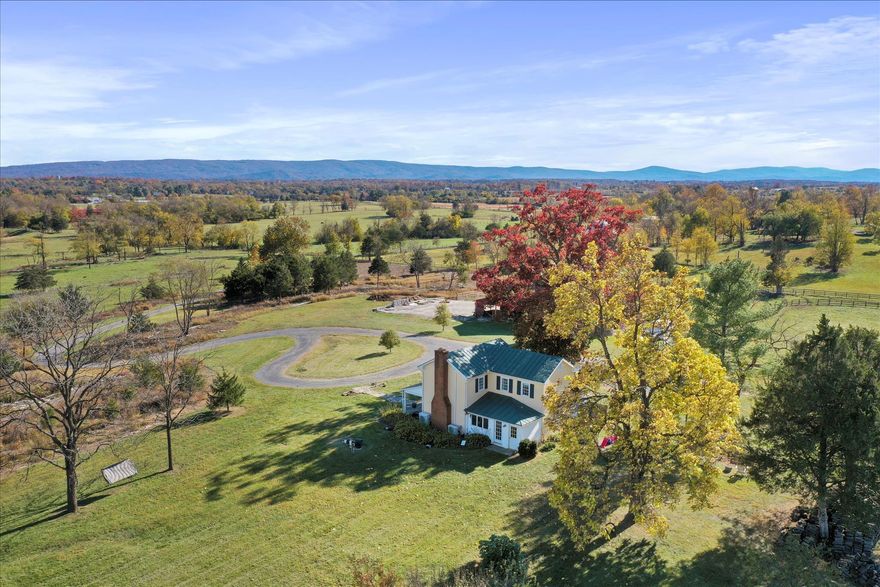 In real estate, it’s all about location. This isn’t just a location—it’s a high-cation. Opportunities like this are exceedingly rare: surrounded by large, protected parcels—many in conservation easement—in the heart of Hunt Country, under $1M, and an hour to Washington, D.C. This is the unicorn, offering a truly uncommon chance to embrace peaceful, abundant country living without compromise.

Awaiting its next stewards, this picture-perfect vintage farmhouse is beautifully sited on 15 acres in coveted Blue Ridge Hunt territory, where a constant breeze and soft eastern mountain views set the rhythm of daily life.

A winding half-mile drive sets the tone, leading to a storybook setting where historic charm meets modern ease. Inside, original hardwood floors, custom built-ins, and a wood-burning fireplace create a warm, inviting atmosphere. Three well-appointed bedrooms feature tailored storage, while a dedicated home office, laundry/mudroom with utility sink, and a private outdoor shower add thoughtful functionality. Every room is framed by picturesque views of the surrounding landscape.

Outdoors, the property is equally compelling. A two-story barn with electricity offers three stalls, a workshop, and ample space for hobbies or future expansion. Additional improvements include a large metal equipment shed, a smaller ruminant barn, and repurposed grain silos reimagined as charming chicken houses—blending practicality with a touch of whimsy.

During their time here, the current owners have thoughtfully shaped the land for both beauty and utility—clearing acreage for pasture, adding extensive fencing, and creating a productive vegetable garden. The groundwork is in place for small-scale animal husbandry and a true farm-to-table lifestyle. It’s a property that invites you to live off the land, surrounded by character and authenticity that typically commands a far higher price point.

For those looking to expand, the vision is already in place. Veritas Construction—renowned for their mastery of historic additions and timeless design—has created expansion plans for both the home and barn, seamlessly blending old and new. These plans convey with the property, offering a turnkey path to elevate the estate while preserving its original charm.  

The dream of country living is already here—quiet, intentional, and deeply rooted in the land—yet thoughtfully prepared for its next chapter.

Ideally located just 6 miles to Berryville, 8 miles to Winchester, and just 20 minutes to Middleburg, this offering strikes a rare balance—peaceful, private, and beautifully connected.  NO DRIVE INS PLEASE.