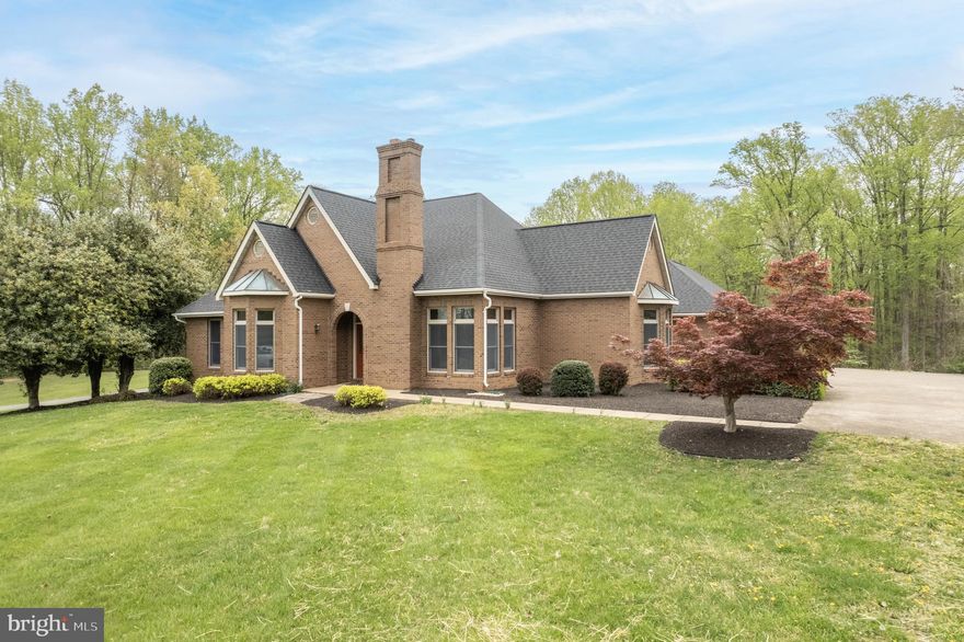 ***  NOTE  ***  This property previously had a VA appraisal of $849,900 .  This is an estate sale , sellers will be reducing  price this week-end .  This home has a  style of it's own ,with almost 5,000 sq. ft. of finished floor space on approximately two acres ( original owner ) . Zoning is A-1 and no HOA .  Brick and stone fireplaces total  four and attached garage totals  five cars . Let your imagination run wild when you see the ( walk up ) floored attic with approximately 1,000 sq. ft. of unfinished space , what a  bonus room . There is also a floored attic ( 16x25 )  over the upper garage . Interior doors on main level are solid wood and the hardwood flooring shines like new money . Master bath and kitchen have been recently upgraded . Can't help but notice the unique rooflines on this gorgeous home , the architectural shingles are only a few years old .  Lower level is finished with lots of open space , owner had it designed for his home office / business , has a full bath and a rough-in kitchen .    Septic system has been inspected and approved by an onsite soil evaluator .  Owner has a conditional modification  permit ( upgrading  to 4 BR. )  , in case new owner desires to add another bedroom .  .