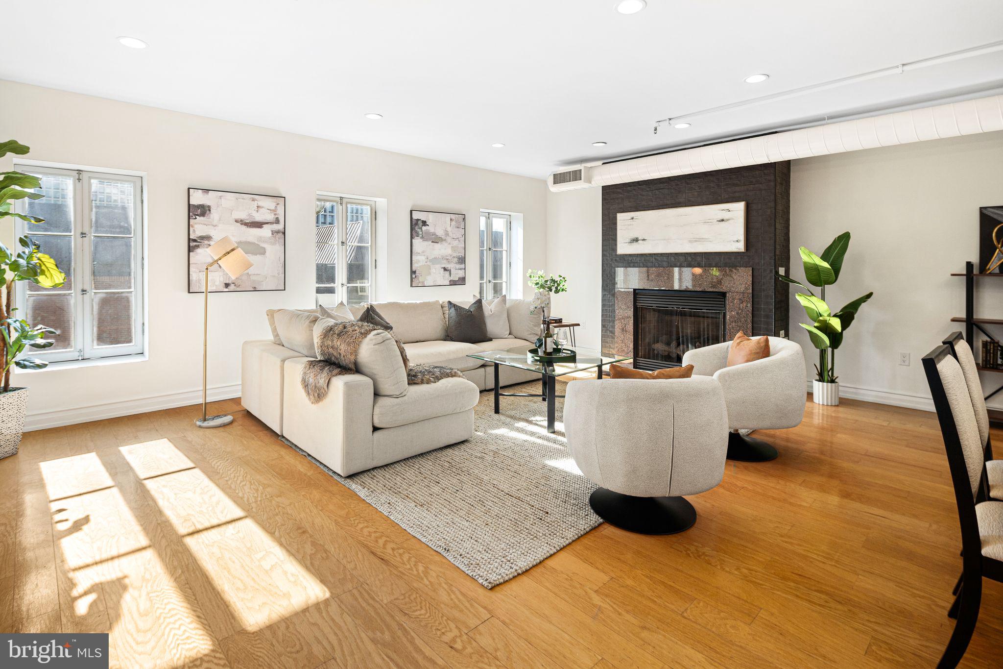 Welcome to The Moravian, where refined sophistication meets modern luxury in one of Philadelphia’s most sought-after neighborhoods. This meticulously renovated bi-level condo at 121-35 Walnut Street, #405, is an exceptional residence offering unparalleled style, comfort, and exclusivity.
Step inside to discover a thoughtfully designed open-concept floor plan that exudes elegance at every turn. The first level, graced with pristine hardwood floors, flows seamlessly from the sleek chef’s kitchen, featuring a stylish breakfast bar, to an expansive living and dining area—perfect for both intimate gatherings and grand entertaining. A cozy gas fireplace adds warmth and ambiance, while a versatile first-floor bedroom, complete with a full bath, offers the ultimate flexibility for use as a study, library, or home office.
Ascend to the second level, where luxury awaits in the grand primary suite. This private retreat boasts a tranquil sitting area, an oversized walk-in closet, and a spa-inspired en-suite bath featuring dual vanities, a stall shower, and a soaking tub—providing a serene escape from the city hustle. A spacious third bedroom, flooded with natural light and boasting soaring ceilings and custom-built closet storage, completes this remarkable floor.
This exceptional home is further enhanced by one deeded parking space and a climate-controlled storage unit, ensuring your every convenience is met.
Residents of The Moravian enjoy exclusive access to a suite of elite amenities, including 24-hour doorman and concierge service, secure fobbed access, and inclusive cable and internet. With its premier location in the heart of Society Hill, this home offers the perfect balance of luxury, convenience, and access to Philadelphia's finest dining, shopping, and cultural experiences.
For those who seek the very best, The Moravian offers a lifestyle like no other.