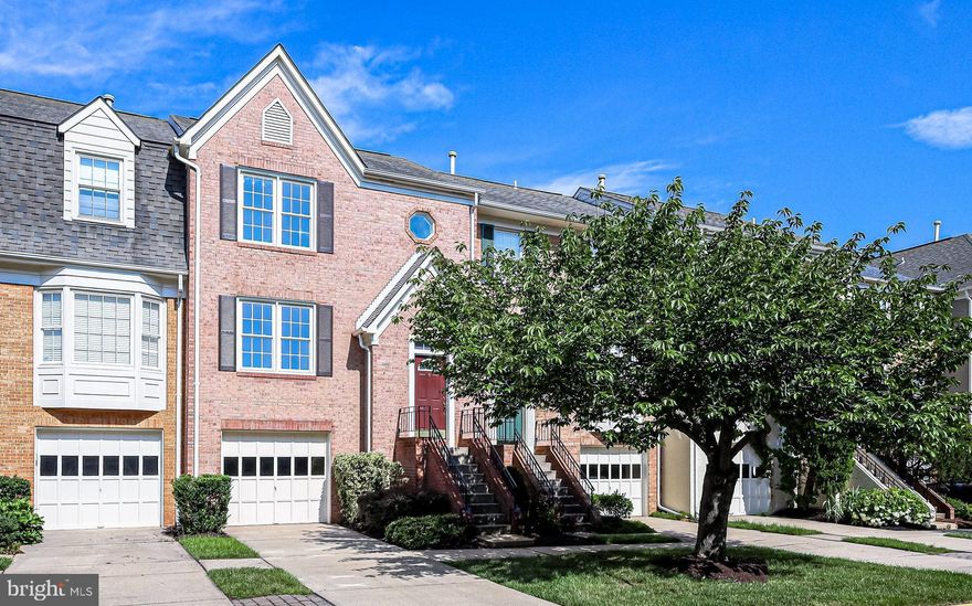 Welcome to this charming townhome located in Tysons Corner, nestled away from the hustle and bustle, offering the perfect blend of suburban tranquility and urban convenience.  This well-maintained light-filled property enjoys tree-lined views from the rear deck with easy access to the Silver & Orange Line Metros, Downtown Vienna events, parks an array of restaurants and premier shopping destinations.  Step inside and be greeted by a welcoming foyer that leads you up a few steps to the hallway open floor plan and spacious living room.  Natural light floods the home accentuating the gleaming hardwood floors.  Adjacent to the living room, you’ll find a separate dining room adorned with elegant wainscoting, crown molding, hardwood floors and a charming chandelier.  The well-appointed kitchen features updated granite countertops, modern stainless-steel appliances and large island that provides both additional workspace and seating.  The kitchen also offers a generous eat-in area with an updated light fixture, providing the ideal spot for casual meals.  Open the sliding glass door and step on to the deck, where you can enjoy peaceful sunsets surrounded by lush greenery of the neighboring trees.  Hardwood continues on the upper level featuring 3 bedrooms and 2 full bathrooms.  The primary bedroom is a true retreat, boasting a huge walk-in closet and spacious, updated bathroom complete with beautiful tile, double vanity and large glass shower.  The secondary bathroom offers a convenient tub/shower combination and vanity.  Cozy up by the wood-burning fireplace in the walk-out lower level of this townhome. This versatile space can be used as a family room, game room or entertainment area. This level includes a powder room, laundry area, large storage room and direct access to the garage.  Open the sliding glass doors and you’ll find a patio and fenced-in yard with a gate, perfect for outdoor relaxation and recreation.  Don’t miss the chance to make this your new home sweet home!