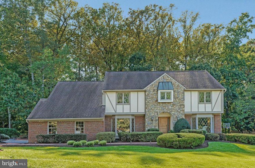 Welcome to 10309 Hickory Forest Drive -  an enchanting, one owner,  storybook Tudor style home in Hickory Hollow Forest, an enclave of 21 custom homes in the heart of Oakton. This exceptional home, thoughtfully designed, features four large bedrooms on the upper level, with an option for a fifth bedroom, four bathrooms, three gas fireplaces, hardwood floors, Plantation shutters,  a lovely screened in porch, multilevel composite decks, underground irrigation system,  Cul de sac lot  and so much more. Prepare to be impressed with this beautiful estate, offering timeless sophistication,  sited perfectly on a park-like .60 acre lot with extensive professional landscaping. With impressive curb appeal, the home features a brick walkway to the front porch and gorgeous hardwood door with leaded glass opening to the spacious and welcoming foyer which leads to an inviting floor plan with both formal and informal spaces. This meticulously maintained home offers exceptional craftsmanship and only the finest quality finishes throughout. Boasting more than 5700 sf of functional living space and a thoughtful, custom design, this home was made for gathering and entertaining with a lovely custom kitchen that opens to an impressive screened in porch with beautiful cherry hardwood floors, a multi level composite deck with stairs to the lower level patio, all with views of the unbridled beauty of the fully fenced rear yard. A true private oasis. 

 From the kitchen, enter the great room with 9 foot ceilings and a grand stone gas fireplace, large dramatic windows and wonderful views of nature. A formal living room and dining room are adjacent the large foyer. Perfect for entertaining. The site line from the foyer to the great room is a fabulous view directly to the stone fireplace. WOW!  A main level study/library, masterfully crafted, featuring custom built-in cabinetry, is perfectly tucked away in the rear corner of the home with a  large bay window overlooking the lovely rear yard. An ideal space to work, read, or simply relax. Finishing up the main level is the laundry/mud room with built in cabinetry and doors leading to the oversized two car garage and the  side portico leading out to the rear deck and driveway.  The attention to detail is unsurpassed with custom finishes throughout, upgraded hardware on doors and cabinets, hand crafted built-ins, hardwoods on main level, a lovely kitchen and 4 beautiful bathrooms. The expansive, luxury primary suite is truly luxurious featuring a gas fireplace, a sitting room and a spa-inspired, renovated primary bathroom complete with dual sinks, walk in shower, soaking tub and walk in closet. Three additional, generous sized bedrooms are on the upper level, a sitting area/reading nook and a hall bathroom.

The finished lower level is truly an extension of the home with a warm and welcoming family room with a third gas fireplace, custom built in bar and sliding glass doors to the lower level patio. The walk- out lower level also offers a game room with pool table which conveys, an exercise room, full bathroom with sauna and large utility/storage room. 

The parklike setting is a dream year round with lush, manicured gardens, shrubs and trees and walking paths through the yard. Enjoy entertaining on the deck, or a quiet evening on the patio watching nature unfold. 

 Public water and sewer are a bonus and allow for the potential to add a pool. 

Desirable Oakton Elementary, Thoreau Middle, Oakton High School pyramid. Minutes from the Oakton Shopping Center with Starbucks, CVS and Giant, and quick access to major commuter routes - 66, 495 and the Toll Road, 3 miles to the Vienna Orange Line Metro.