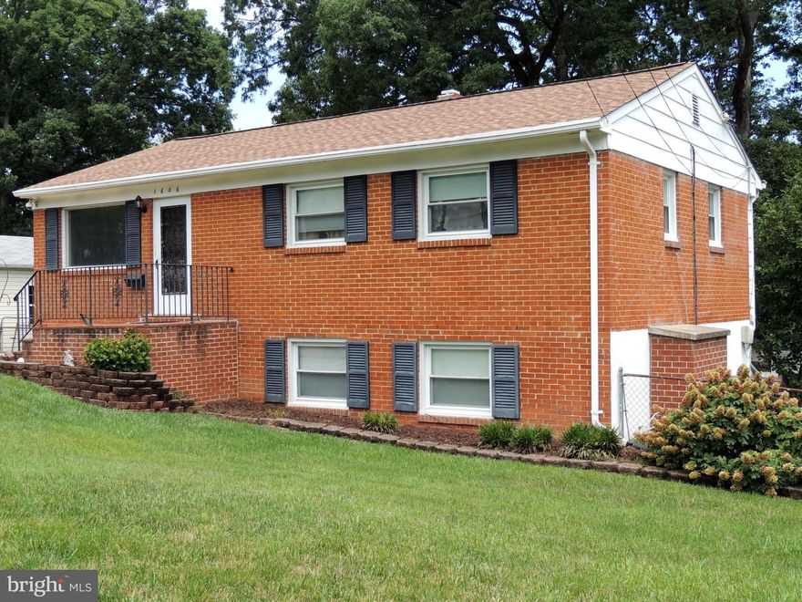 Home is where the heart is and you will love this well cared for home. This move in ready home offers many recent updates that include a newer roof, vinyl windows and doors, central A/C, water heater, washer/dryer, and more.  The main level boasts an inviting living room that is the heart of the home. It smoothly connects to the dining/kitchen combination. Complete with chandelier, access to the outdoor deck, gas range, dishwasher, refrigerator, microwave, disposal, and plenty of updated cabinets to satisfy the best cooks.  Down the  hall are three bedrooms that are sure to provide the retreat needed after those long days. The spacious main bathroom is adorned with tile and cabinetry complete this level. (hidden beneath the carpet is hardwood flooring waiting to shine) The lower level provides an additional large bedroom, an oversized family room that is just the place for entertaining, watching games on the big screen, or simply relaxing in front of the gas fireplace. Did I forget to mention the half bath, laundry room with washer and dryer and ample storage and shelving for all your needs? The backyard encourages outdoor living with the huge sundeck and spacious brick patio. Both overlook the fenced, private tree lined yard, with three storage sheds.  No concerns for parking, as this home allows for multiple cars in the concrete driveway and or on street parking. This home awaits your personal touches to make it your own for years to come.  Ya'll come.