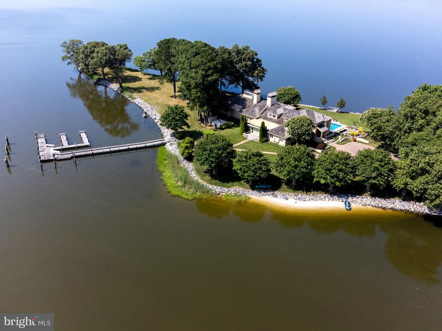 Miles River estate at the end of Marengo Farm Road, boasts 270 degrees of waterfront with a dramatic sunrise and amazing sunsets, this offering provides numerous opportunities to enjoy life on the Shore.

The property is located 8 miles to Easton and less than 2 miles to St. Michaels by water.   Providing an unparalleled presence as Hunting Creek joins with the Miles River, this point of land has deep water and protection on the lee shore for the yachting enthusiasts.  Additional highlights include a 2-acre tidal pond that attracts a host of waterfowl and wildlife, over 2,600 feet of riprap-protected shoreline, a sandy beach, a tennis court located 50 feet from the water’s edge, a pool, a caretaker cottage, and a primary residence with an irreplaceable footprint.  Located entirely within the buffer, the residence was originally constructed in 1980 with renovations in 1989.  The international architecture with an open floor plan provides an inviting atmosphere for entertaining with three guest rooms and two primary suites.  A billiards room, screened porch, two-bedroom caretaker cottage, and four-car garage offer a wonderful opportunity to update existing improvements.  The footprint of this house and improvements are within the buffer and irreplaceable by today's zoning standards.