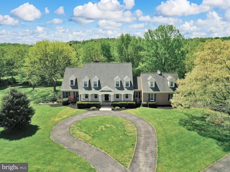 You won't want to miss this beautiful 92  acre clean and green estate with 5228 sf all brick custom built home!  There are several restored outbuildings including a large bank barn and RV/boat pole building, a workshop and a tennis court!  One additional building right, 20 acres of pasture.  Home features gleaming oak floors throughout 1st floor. Custom features include cherry kitchen cabinets with island and peninsula  breakfast bar plus breakfast nook with slider leading to patio.  2 story family room with beautiful stone fireplace from floor to ceiling with woodstove to keep you cozy. There are sliders to the patio.  First floor primary bedroom is huge with a sitting room  with slider door leading to patio. There is walk in pantry with built in cabinets, some with glass doors.  Formal living room and dining room with picture molding a crown molding trim.  3 large bedrooms and 3 full baths on upper level.   Primary bathroom has all the bells and whistles....whirlpool tub, double sinks, huge glass block walk in shower.  Walk in closets in each bedroom!  BR 2 has it's own Bath and BRs 3 & 4  share a jack n jill bath. Also a bonus room off one bedroom, unfinished space over garage, great storage, or could be finished.   2 newer 50 gallon water heaters Property has 2 wells, one for home and one for barn. Finished walk out basement, including additional family room with brick wood burning fireplace, rec room with pool table, huge laundry room with sink and many cabinets great for a craft room. Stocked Muddy Creek runs through the property for great trout fishing right from home.   A part of Orson Creek does as well stocked with rainbow trout. There is 20 acres of pasture land. Many white tailed deer roam around.   Hunt , fish and play at this unique property.   BE SURE TO CHECK OUT THE VIRTUAL TOUR OF THE LAND!