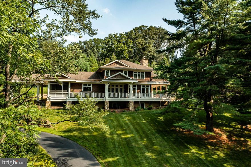 Welcome to 1330 Yellow Springs Road in Chester Springs, PA,
where a Bali yoga resort meets the classic cedar-shingled homes
of New England! 2.5 acres of privacy in the quaint yet vast
Chester County will take your breath away, beginning with your
first glimpse through the trees of this beautifully situated
property. A rare abundance of tranquil outdoor entertaining
spaces makes the most of this estate: a screened-in porch,
extensive mahogany deck with covered dining section, covered
porch with outdoor fireplace, and a patio laid with a rare version
of bluestone. Through the generous, elegantly lit front door,
enter a gracious 9 foot high foyer that sets the tone for the open
floor plan featuring 4 bedrooms, 3 full bathrooms and 1 powder
room. You’ll want to roam the house a few times to absorb the
attention to natural elements in the architecture and design. The
Great Room is flooded with natural light, with a wet bar for easy
entertaining (copper sink, beverage refrigerator, ice maker,
floating shelves and a glass mosaic tile backsplash).The floor-to-
ceiling stone fireplace holds random stone ledges for candles,
while the 10 foot high Douglas Fir beamed ceiling is a nod to the
surrounding wooded landscape.
The airy custom gourmet kitchen is a food enthusiast’s dream –
whether you’re the chef or the guest. Form meets function,
beginning with expansive granite counters and a huge island for
prep. Note the classic Shaw’s Original farmhouse sink, tiled Pratt
& Larsen crackle finish ceramic back splash with accent pieces,
and vaulted stained white oak ceiling with uplit perimeter. A
tumbled limestone tiled floor, commercial grade Viking appliances,
Miele dishwasher, and Kraftmaid cabinets complete this gorgeous
cooking and entertaining space. There is an adjacent flex room
(craft, office or pantry, your call!), so the sky’s the limit to make
this space fit your needs.
A massive laundry room is on the main level for your
convenience, complete with a deep sink, hanging clothes bar, and
plenty of cabinetry for extra storage.

On the main level, you’ll also find additional space currently used
as a Retreat/TV room, finished with huge built-in bookcases.
Heated tiled floors and multiple glass doors to the patio finish a
cozy space that, whether you stay in or venture outside,
celebrates bucolic views. The Retreat leads into an office
complete with a full bathroom (with zero-entry shower) and
provides access to an outdoor shower. This area can easily be
converted into a guest, primary, in-law or au pair suite.

The upper level is just as special with a spacious primary suite
complete with vaulted wood beamed ceilings, two large walk-in
closets, an additional storage closet for luggage, etc., plenty of
natural light, wood floors, a finished Dressing Hall with custom
built-in drawers and shelving and private sunning deck. The
sundeck is the ideal spot for early morning coffee or sunset
cocktails -- and could even be used by a DJ for a special party as
it overlooks the backyard patio area and lawn. The primary
bathroom is spa-inspired, with “Ocean Mist” glass tile, heated
floor, deep Kallista soaking tub, steam shower and Japanese Toto
toilet. A vaulted Douglas Fir beamed ceiling over the 2 nd floor
landing and stairs and two additional spacious bedrooms and hall
bathroom complete the upper level in the spirit of the rest of the
house.
The unfinished lower level is ready for someone to finish to their wishes, with sufficient HVAC
and electric capacity already in place, as well as a rough-in for a
bathroom. The home includes a monitored home security system
as well.