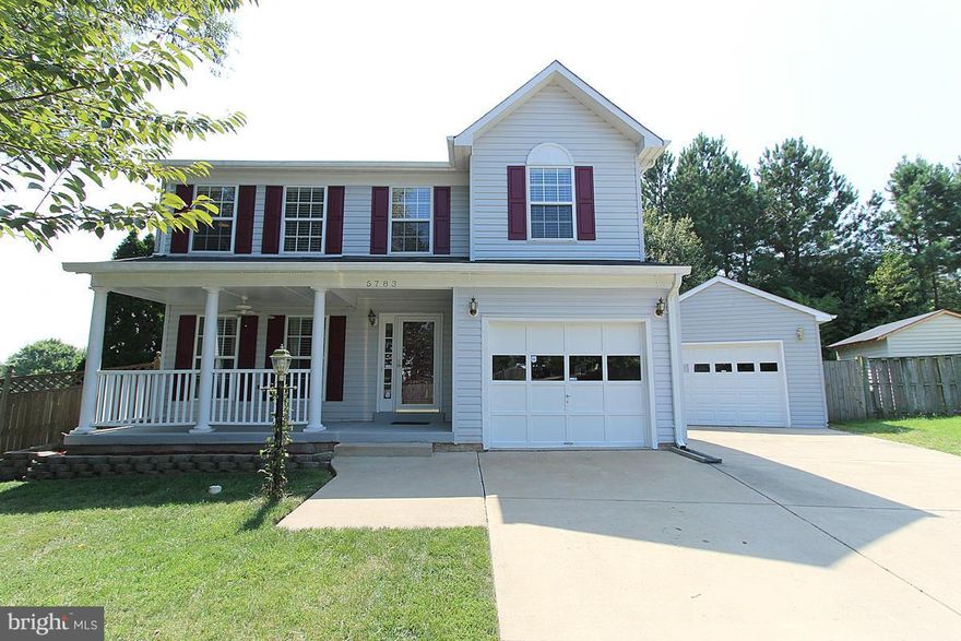 What are you waiting for? This is it,3 fin levels, vaulted ceilings, gas fireplace, granite counters, 42" cabinets,  hardwood floors, fully finished basement with projector, full bath, 4th bedroom (NTC) and large storage, covered sun filled porch, 2 car garage-1attached 1 detached, front porch, crown moldings, chair rail, mbr suite with walk-in closet and full bath, cul-de-sac lot & so much more.