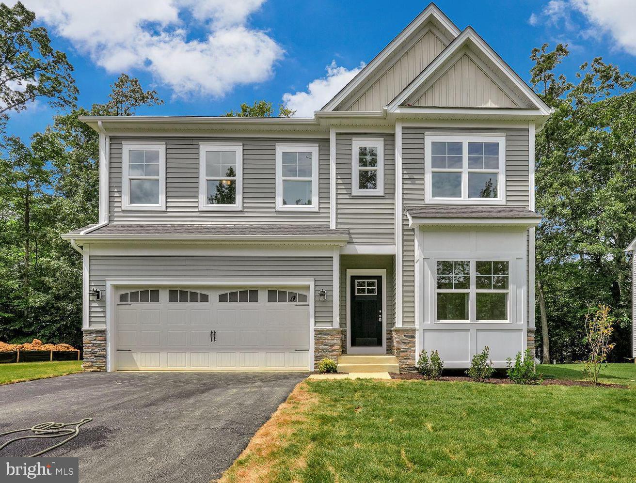 Home is Finished and Ready for you!!
Discover the Monroe — a beautifully crafted new construction home that blends modern comfort with timeless design.
Step into an open-concept layout that seamlessly connects the living room, dining area, and kitchen—an ideal setting for both everyday living and entertaining. A 2-foot cantilever extends the great room, providing additional space and enhancing the home's spacious feel.
At the heart of the home, a generous kitchen island invites casual dining and easy meal preparation. Outfitted with stainless steel appliances and ample cabinetry, this kitchen is designed to meet the needs of both daily routines and special gatherings.
A charming bay box window fills the front room with natural light, creating a bright and flexible space perfect for a home office, reading nook, or personalized retreat.
The owner’s suite offers a private sanctuary, complete with a walk-in closet and a luxurious en-suite bath—your own serene escape at the end of each day.
The basement boasts a generously sized finished recreation area, a full bathroom, and a comfortable bedroom—perfect for guests, entertaining, or additional living space.
Curb appeal is elevated by a stylish decorative garage door, adding character and charm to this thoughtfully designed home.
Disclaimer: All renderings/photos provided herein are for illustrative purposes only and are intended to showcase design options. Actual products, features, finishes, and layouts may vary. The images may depict optional features, upgrades, or configurations that are not included as standard or available in all homes.