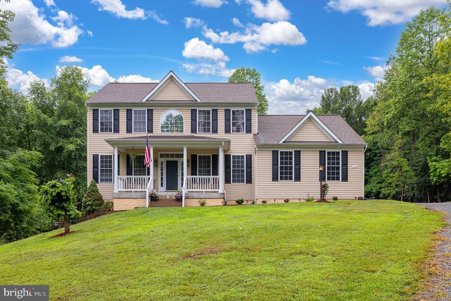 Surrounded by trees this gorgeous colonial is on two secluded acres a few minutes from the Stafford County line.   Traditional floor plan, formal living and dining rooms with crown molding, office with hardwood flooring, family room with vaulted ceiling and wood burning fireplace, large open kitchen with island.  Primary master suite with walk in closet and bathroom, and three additional bedrooms.  Full unfinished basement.  Two car side load attached garage, one car detached garage. Endless possibilities with the outdoor space here.