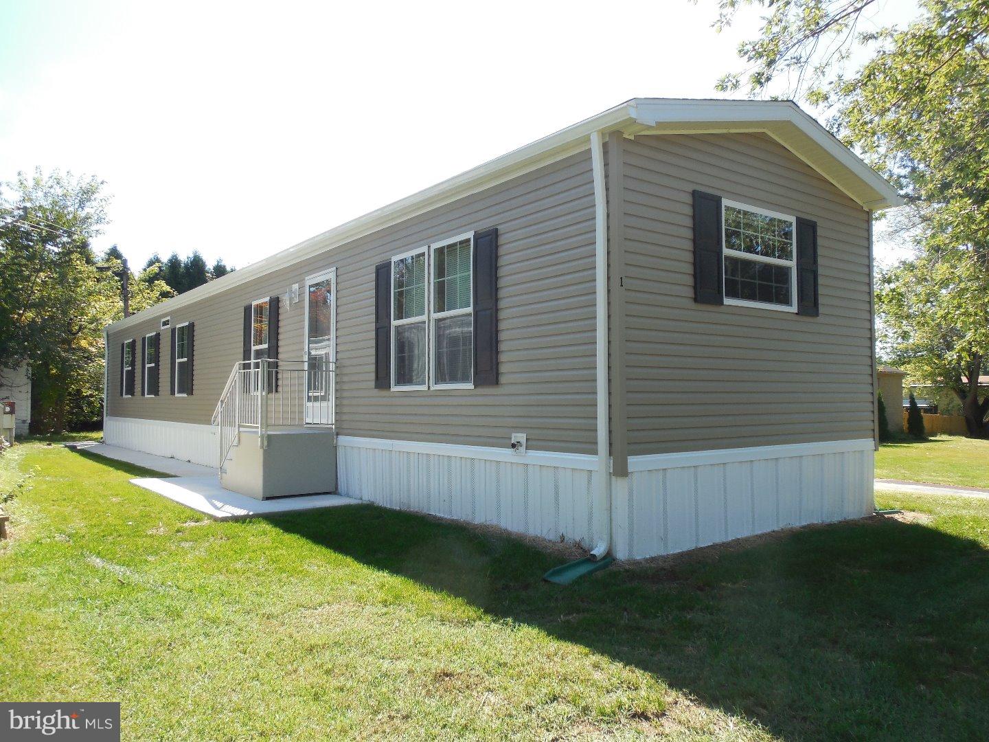 Brand new 2015 Sunwood by Skyline 14x70 feet. Home located on the last lot in the community. Large kitchen with walk in pantry, 42" cabinets, 10 recessed lights, Whirlpool appliances, double stainless steel sink, spacious eating area. Living room with ceiling fan, 2 bedrooms and 2 full baths hallway laundry area and back door. Buyer must get approved by park management. Lot rent is $310/month, includes sewer and trash. 2 pets allowed, only one dog plus and additional $5/mo. Serial#3111-0805H Model: E269B. 15 Month manufacturer warranty provided to buyer at closing! 2 Month Free Lot Rent at Start of Lease!
