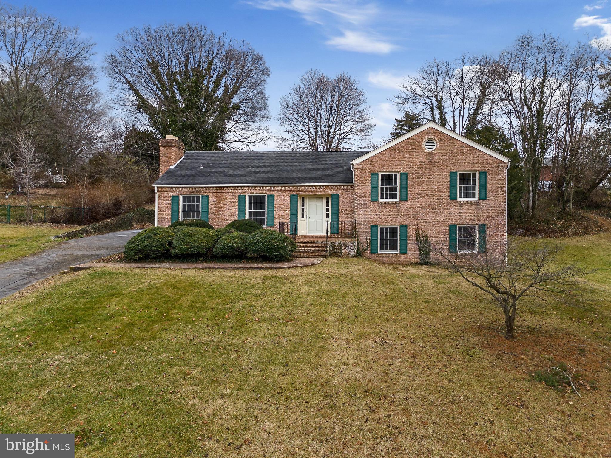 Discover the charm of this timeless all-brick home just half a block from the Jefferson Memorial Park in downtown Charles Town, WV! Boasting four bedrooms and meticulously maintained by its original owner, this residence sits on nearly half an acre (0.4 acres)!
Graced by pristine hardwood floors throughout the main level this home is a great opportunity to own and close to lots of amenities! Featuring a recently updated kitchen with granite counters, stainless steel appliances, and a convenient full pantry. Choose your dining ambiance – enjoy al fresco meals on the poured cement patio accessed through the screened porch, dine formally in the formal dining room off the kitchen, or gather around the kitchen island.
Embrace the coziness of chilly nights by the wood fireplace in the spacious formal living area, also with hardwood floors. Upstairs, the primary bedroom boasts an attached bath, while the half bath serves the two additional bedrooms. The lower level invites you to a large family room, the 4th bedroom, and a full bathroom.
Convenience meets functionality with a large laundry room featuring a wash basin and a workshop with a walkout to the side yard on this level. Jefferson Memorial Park is a 10-acre park just steps away, offering two playgrounds, a pool, tennis courts, pickleball, basketball, picnic pavilions, and a walking path. All of this is within walking distance to downtown shops, restaurants, and the farmers market. ***Updated heat pump for modern, convenient heat and air!