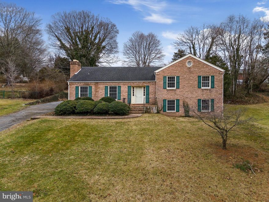 Discover the charm of this timeless all-brick home just half a block from the Jefferson Memorial Park in downtown Charles Town, WV! Boasting four bedrooms and meticulously maintained by its original owner, this residence sits on nearly half an acre (0.4 acres)!

Graced by pristine hardwood floors throughout the main level this home is a great opportunity to own and close to lots of amenities!  Featuring a recently updated kitchen with granite counters, stainless steel appliances, and a convenient full pantry. Choose your dining ambiance – enjoy al fresco meals on the poured cement patio accessed through the screened porch, dine formally in the formal dining room off the kitchen, or gather around the kitchen island.

Embrace the coziness of chilly nights by the wood fireplace in the spacious formal living area, also with hardwood floors. Upstairs, the primary bedroom boasts an attached bath, while the half bath serves the two additional bedrooms. The lower level invites you to a large family room, the 4th bedroom, and a full bathroom. 

Convenience meets functionality with a large laundry room featuring a wash basin and a workshop with a walkout to the side yard on this level.  Jefferson Memorial Park is a 10-acre park just steps away, offering two playgrounds, a pool, tennis courts, pickleball, basketball, picnic pavilions, and a walking path.  All of this is within walking distance to downtown shops, restaurants, and the farmers market.   ***Updated heat pump for modern, convenient heat and air!