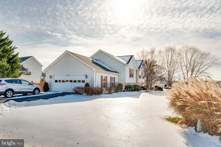 Offers due by Tuesday.  Roomy home in excellent condition with lots of updates and a great location.  Large open family room, dining area, and island kitchen with hardwood flooring that looks new.  Granite countertops, high-end appliances (all appliances convey), newer architectural shingle roof, deck off the dining area, and large fenced backyard.  There's an oversized 2 car garage and an extended driveway so lots of parking - easily fit 6 cars,   SO much more for the money than new construction.  And it's a short drive or even walking distance (less than a mile) to the best shopping in that area:  a large new Weis grocery store, Home Depot, Kohl's, and Marshalls (my 2 favorites) plus several restaurants.  Rt 9 is 3 minutes away, The MARC train is a 7 min drive - as is downtown Charles Town.  So you are close to everything you need.   And It's nice to know you'll be moving into a home that has been so well taken care of by the owners.  You're gonna love this home. Check out the video for tour of the home and community.