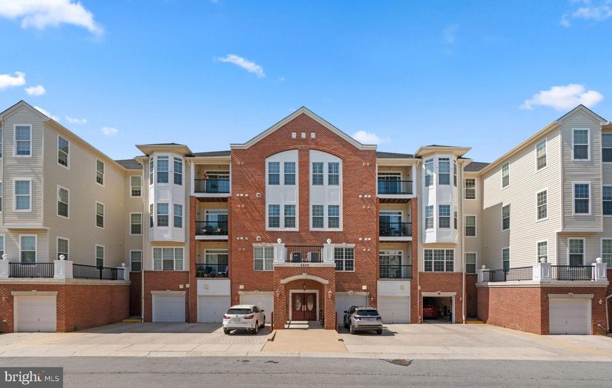 Enjoy a low maintenance lifestyle in a secure elevator condominium building in the gated 55+ age-qualified Gatherings at Jefferson Place community hosting this 2 bedroom and 2 bath home with a 1-car conveying garage! An elegant lobby sets the stage for this sunlit home featuring freshly painted interiors, LVT flooring, an open floorplan with generous closet space, a laundry room, and a foyer entry opening to the kitchen boasting 42" maple cabinetry, sleek counters, a stainless steel KitchenAid appliance suite, and a pass-through window to the dining area. An open dining room flows to an enhanced living room capped by a deep tray ceiling and brightened glass slider access to a private balcony. Owner's suite presents lighted ceiling fan, a tray ceiling over the sleeping area, a sitting room with a trio window view, a walk-in closet, and a private bath with a dual sink vanity and a glass enclosed shower. Amazing location across from Long Gate Shopping Center, convenient to golf courses, parks, shopping, dining, commuter routes, BWI airport, and more! 1 assigned garage spot conveys [letter G]