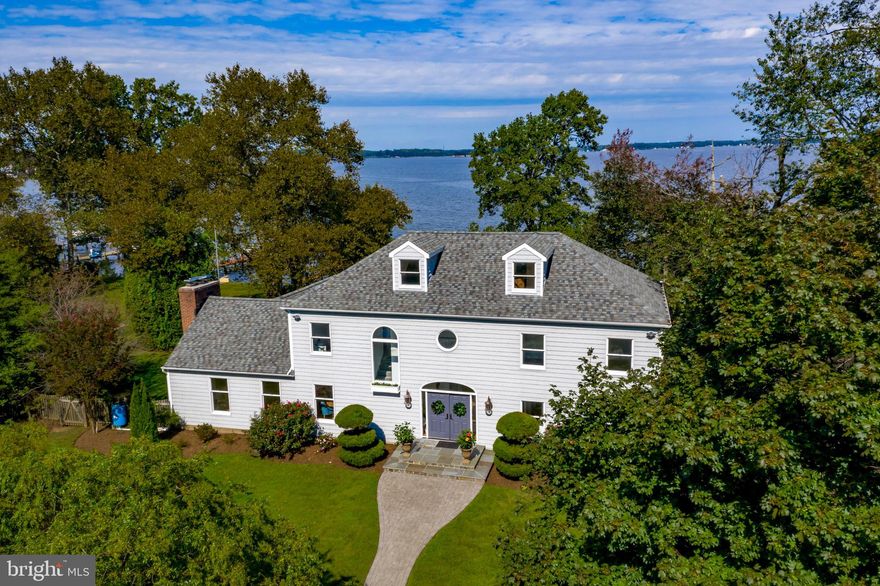 Leave the City behind and find safe haven on Persimmon Point in Cape St Claire .  This handsome 5 bedroom, 3 full bath, waterfront, coastal contemporary showcases sweeping views of the Magothy River, Gibson Island and the Chesapeake Bay.  The home is  located on 2 landscaped and fenced lots with approx. 156 ft of water frontage, 100 X 10  ft T pier, and  2 boat lifts,10,000 and 8000 lb respectively.  The sellers have just completed  a major renovation on their family home with a new gourmet  white  kitchen, stainless appliances, granite, hardwoods floors, new carpet and updated baths.  The open floor plan is flooded with light and offers vaulted ceilings, wood burning fireplace, wet bar and  dining area.  The family room/living room opens  to a four season sunroom room which doubles as a screened porch in the summer.  A large entertaining deck over looks a volley ball court and the pier.  A third floor  28 X 16 ft  unfinished bonus room  awaits  the buyer's needs. The 1562 ft unfinished  basement  with exterior entrance is perfect for water sports storage or huge workshop.   There is a detached oversized 2 car garage which  also has an office  above and a full bath below. It's the perfect spot for working at home in the  new zoom era, or fits the needs of a furloughed college student, au-pair suite or  studio seeking artist. A whole house generator cycles on  weekly. The community offers a club house, beach,  marina, boat ramp, and playground.  Wonderful full time residence, family compound, or weekend  retreat. Minutes to Shops and restaurants. Broadneck schools.   While this property is in a trust the Sellers disclose they  are in process of minor work to a section of the bulkhead. There are 2 dead trees that an eagle and an osprey roost in and the sellers have permits to remove them  if the buyers prefer.