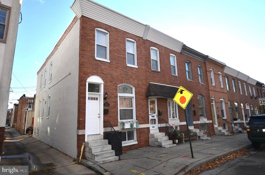 Beautifully renovated 4-bedroom 3.5 bath end-unit home in Canton,  with a view of Patterson Park! Marble front stairs and exposed brick wall shows plenty of character! Hardwood floor and upgraded fixture through-out! The main floor features a cozy living room filled with natural light, a powder room, updated laundry. The gourmet kitchen with quartz countertops, custom cabinets, stainless-steel appliances, and center island. The upper level has two spacious bedrooms, 2 full bathrooms,  with an abundance of closet space. The lower level includes 2 bedrooms, a full bath, access to the included rear parking pad. Enjoy all that the waterfront community has to offer with a short walk to Canton Square for convenient access to shopping, dining,  recreation, and Paterson Park for relaxing and Exercising!