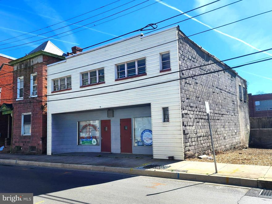HUGE PRICE INPROVEMENT! 💲💲💲
ARE YOU LOOKING FOR A COMMERCIAL PROPERTY CLOSE TO DOWNTOWN CUMBERLAND?  This one could be for YOU!   This property features two units!  Downstairs is an open floorplan with a separate utility room, two half baths and a meeting hall, which the building itself was the former  Western MD Central Labor Council.  Upstairs features  9 rooms which include a conference room, offices spaces, full bath and kitchen.  The building is in need of rehab.  Roof currently leaks and has caused water damage to the carpets, ceilings etc.  Overall, if you are willing to put in the time, effort, and investment, this commercial building could be a great opportunity to create two desirable rental units in a prime location!  Call today to schedule a tour! 
More pictures coming soon!